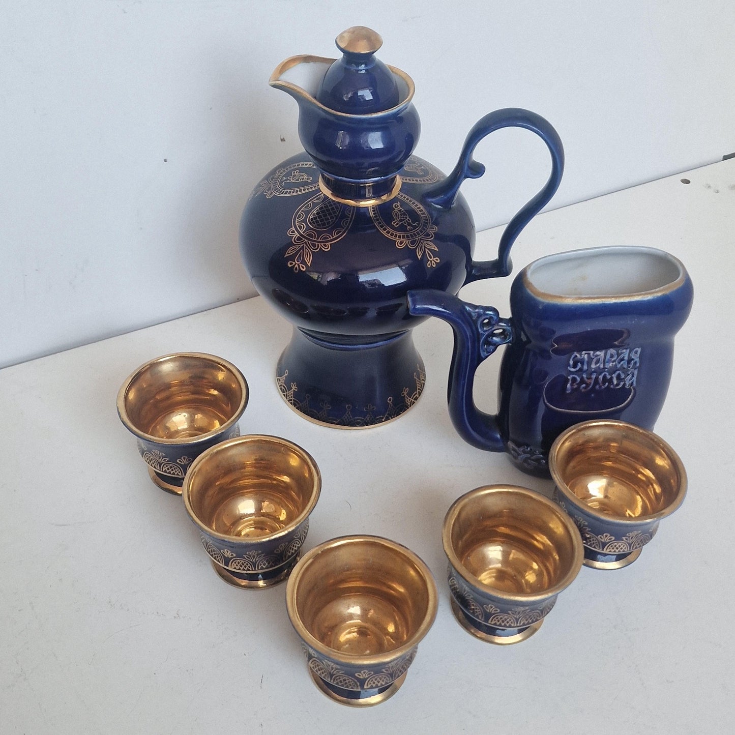 Vintage Soviet cobalt blue ceramic vodka / liqueur server set with goldinterior shot cups – Staraya Russa Russia. Authentic liquer serving