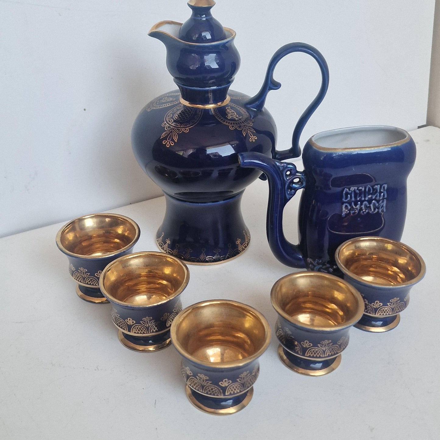 Vintage Soviet cobalt blue ceramic vodka / liqueur server set with goldinterior shot cups – Staraya Russa Russia. Authentic liquer serving