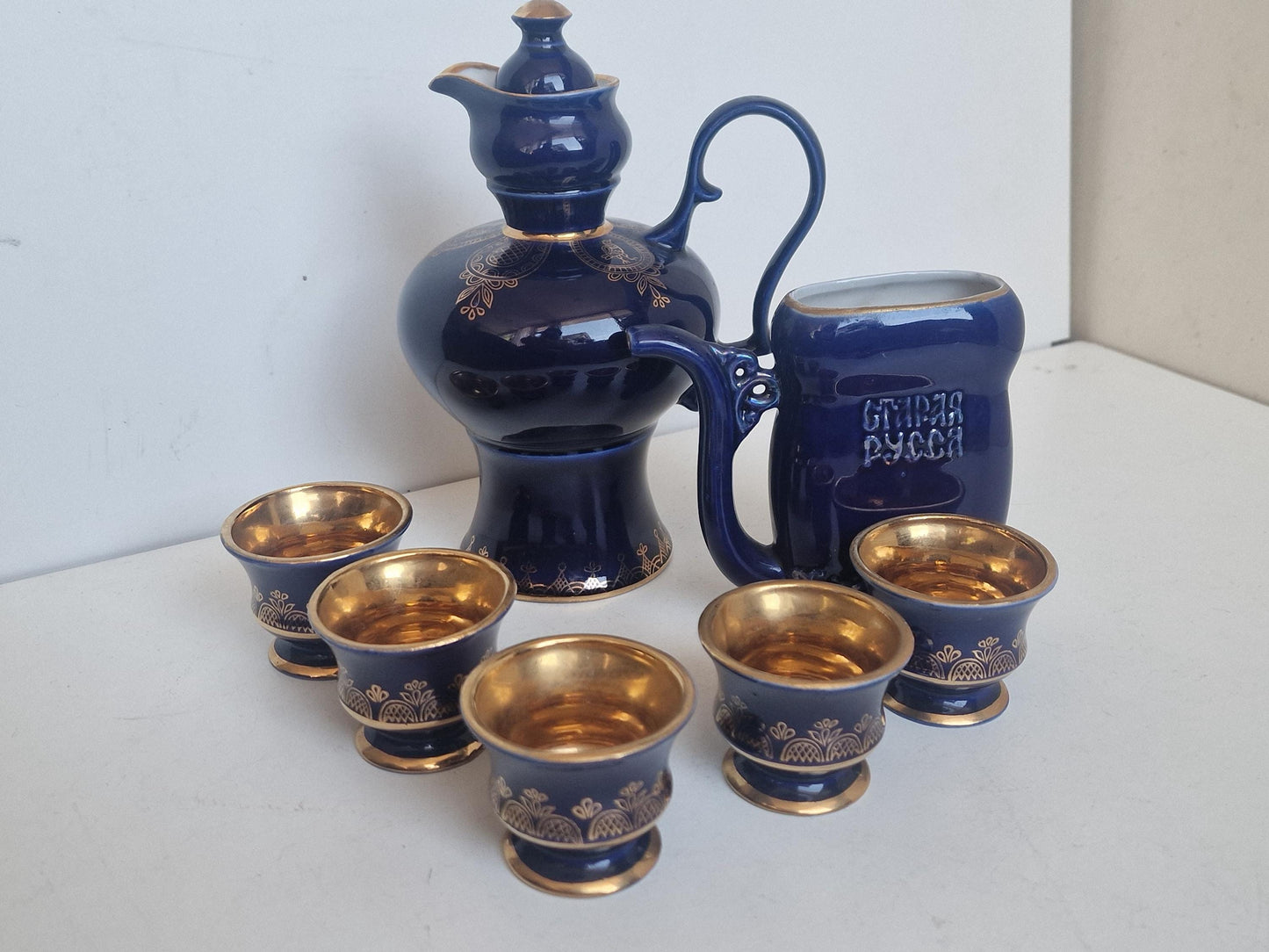 Vintage Soviet cobalt blue ceramic vodka / liqueur server set with goldinterior shot cups – Staraya Russa Russia. Authentic liquer serving