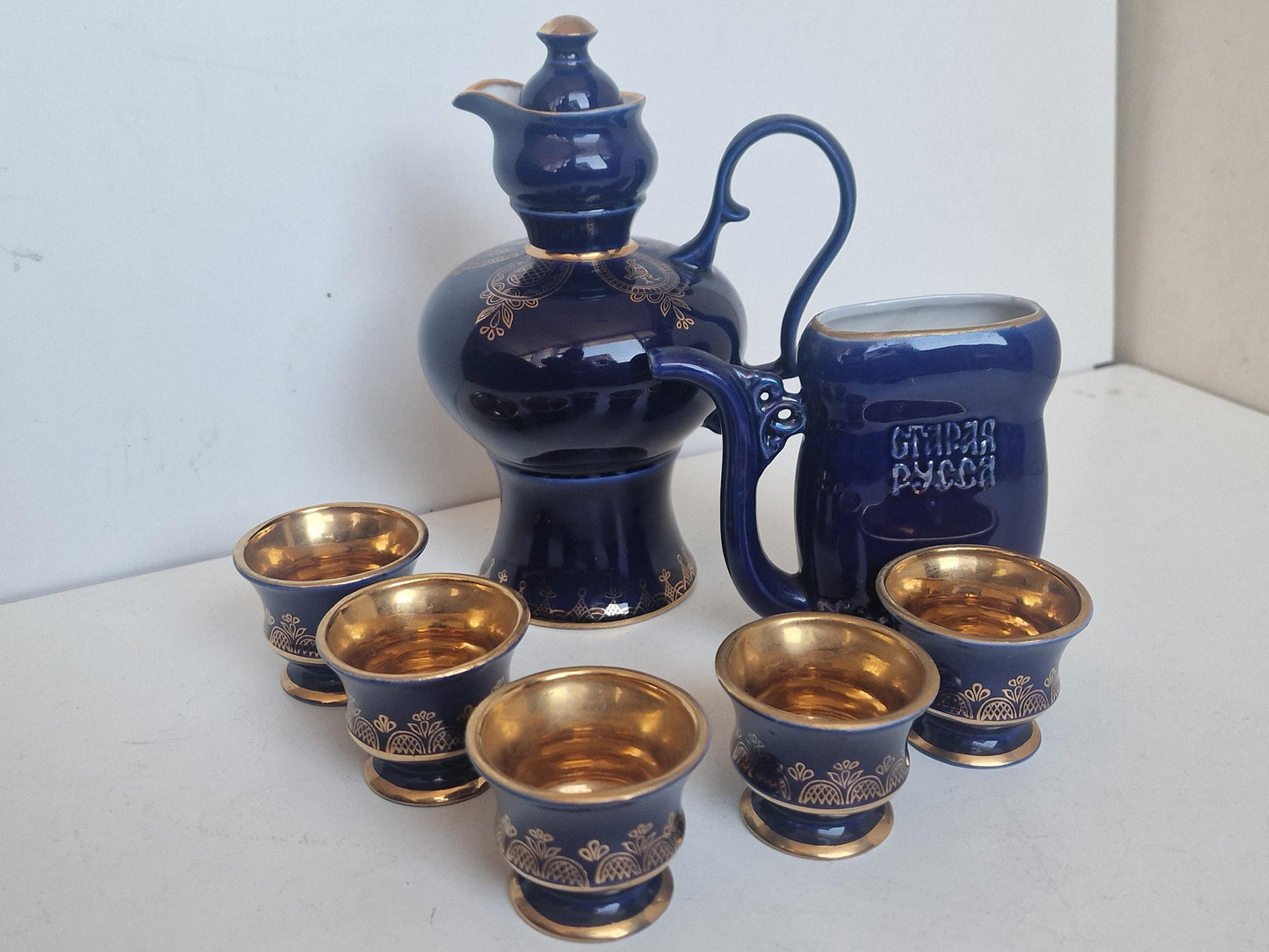 Vintage Soviet cobalt blue ceramic vodka / liqueur server set with goldinterior shot cups – Staraya Russa Russia. Authentic liquer serving