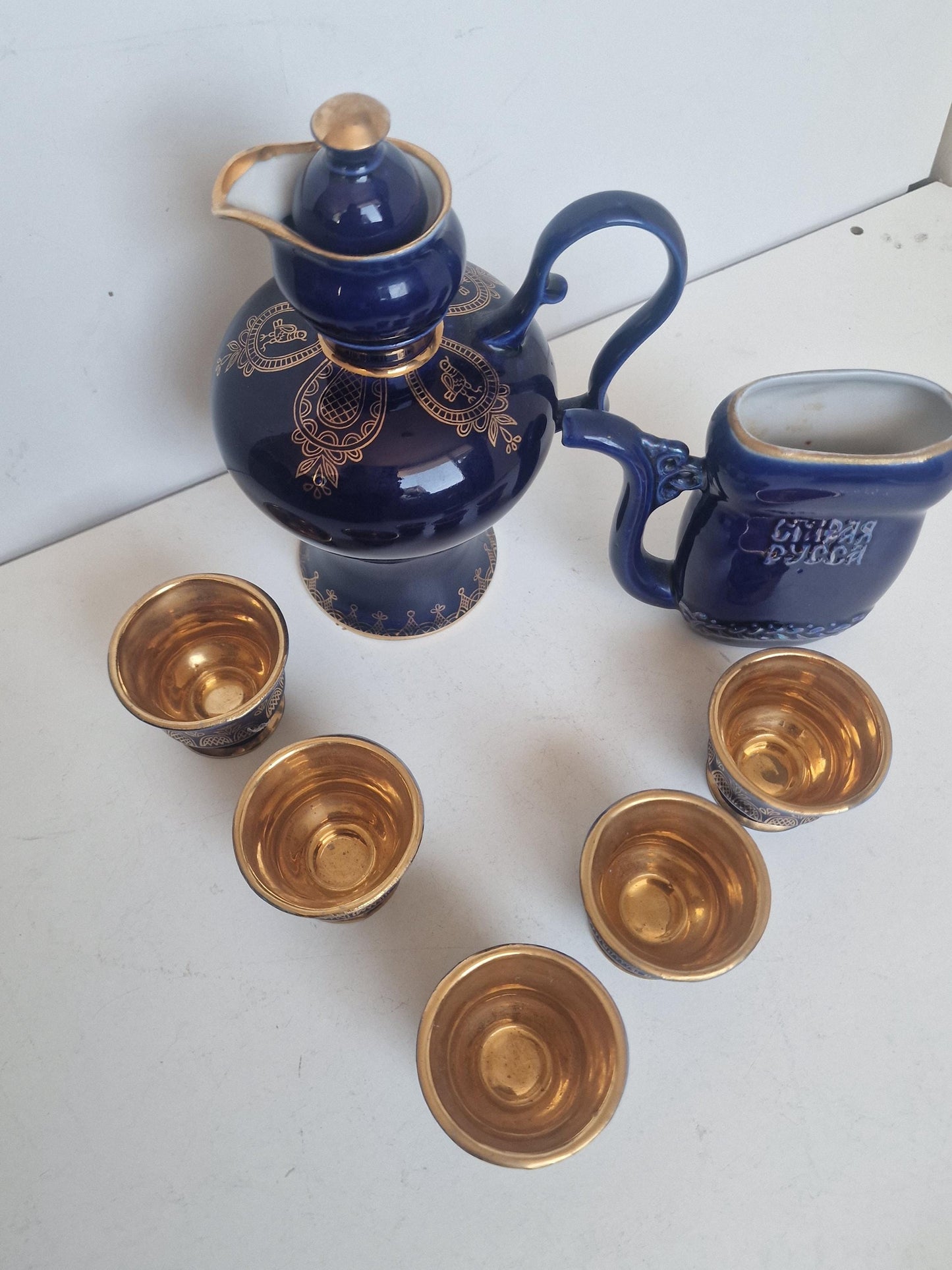 Vintage Soviet cobalt blue ceramic vodka / liqueur server set with goldinterior shot cups – Staraya Russa Russia. Authentic liquer serving