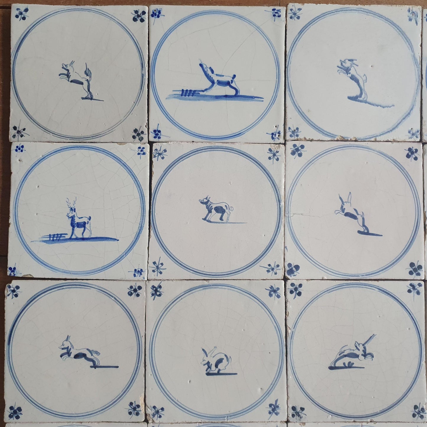 25 Antique Dutch Delft Tiles, 18th Century Animal Motifs circle springer