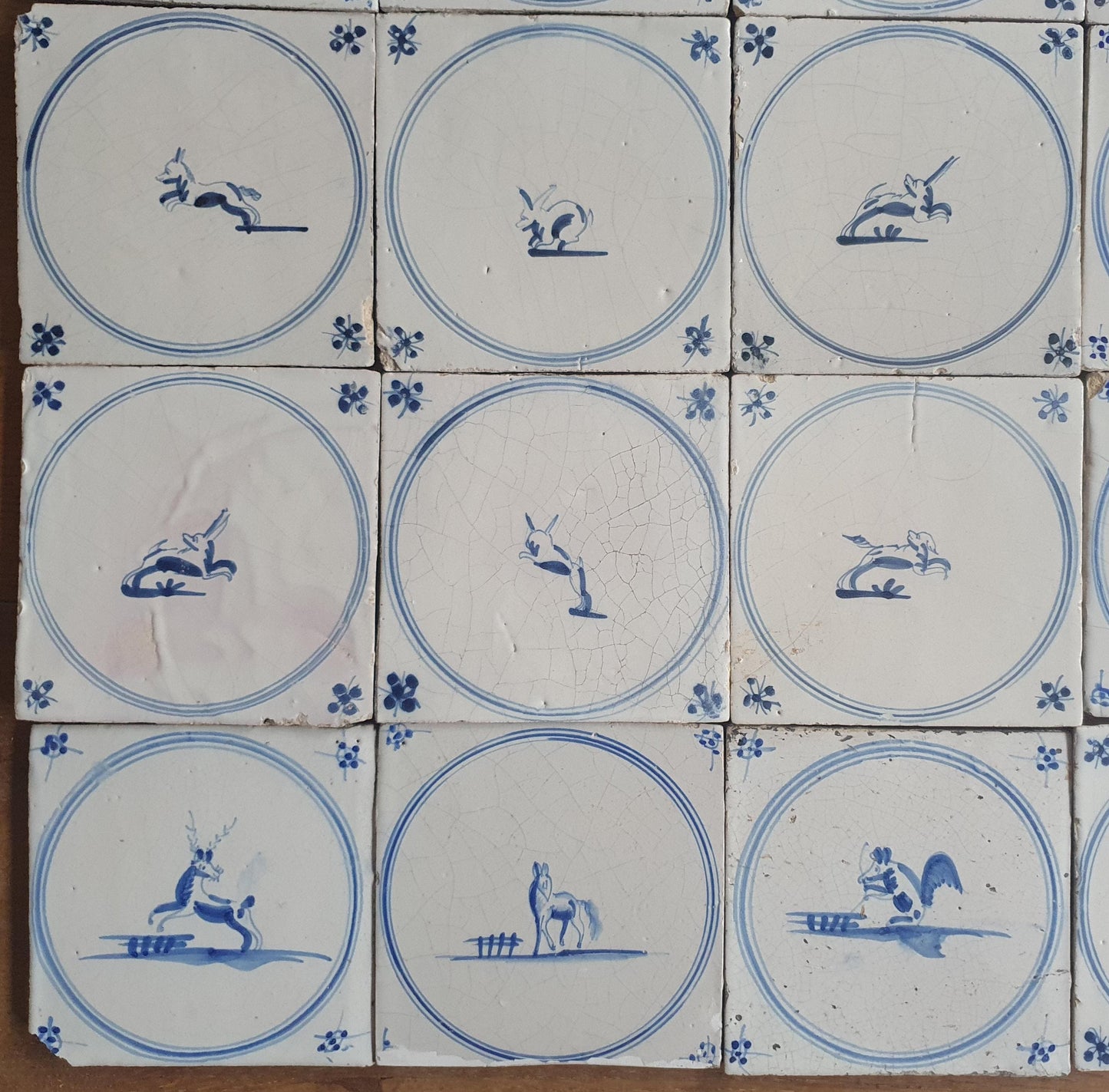 25 Antique Dutch Delft Tiles, 18th Century Animal Motifs circle springer