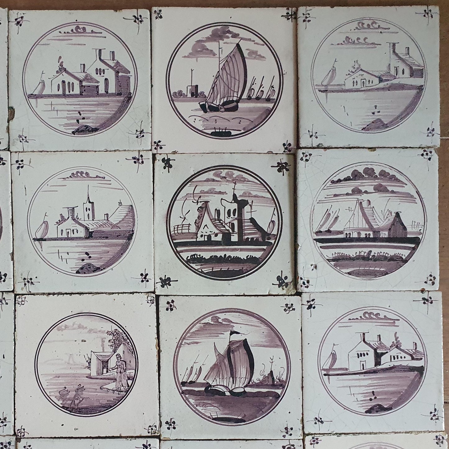 20 antieke Nederlandse wandtegels, cirkeltegels landschap in de kleur mangaan; Delft Blue Dutch backsplash fireplace tiles.