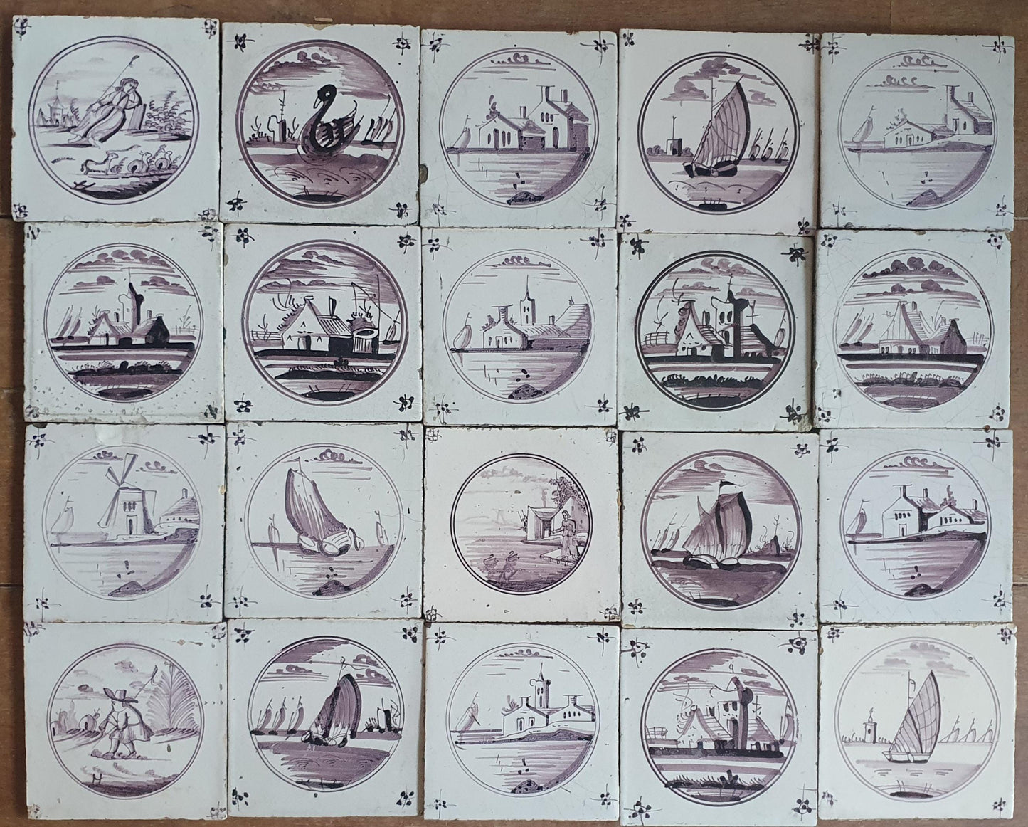 20 antieke Nederlandse wandtegels, cirkeltegels landschap in de kleur mangaan; Delft Blue Dutch backsplash fireplace tiles.