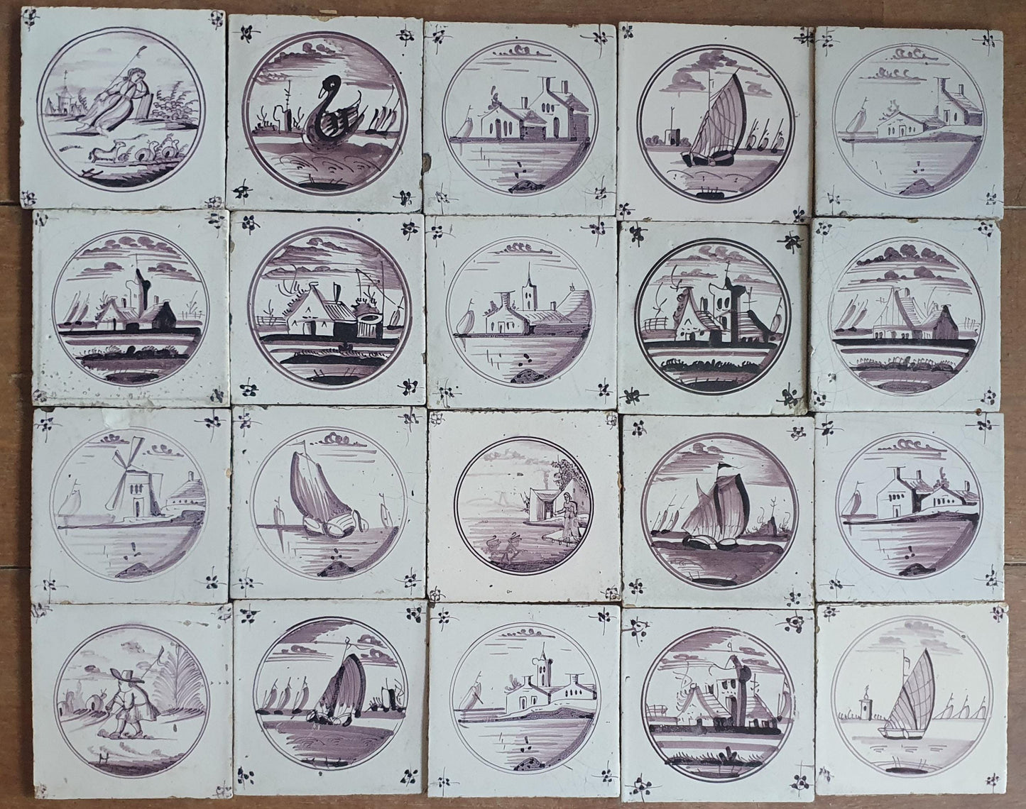 20 antieke Nederlandse wandtegels, cirkeltegels landschap in de kleur mangaan; Delft Blue Dutch backsplash fireplace tiles.