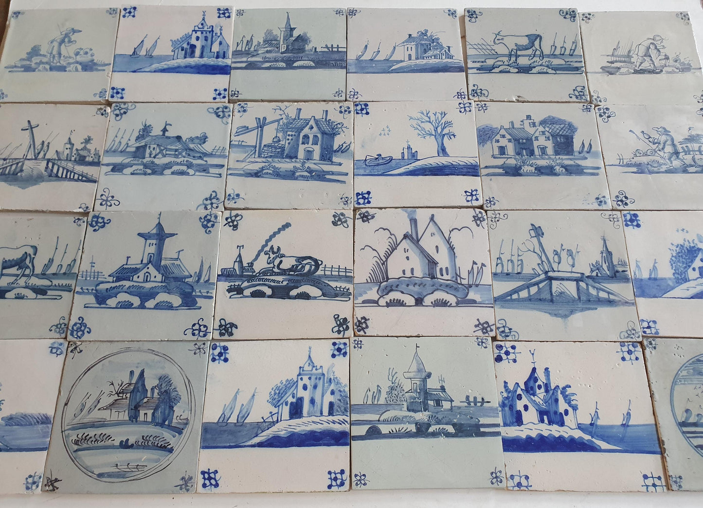 18th/19th  Delft tiles, a landscape of antique tiles of 24