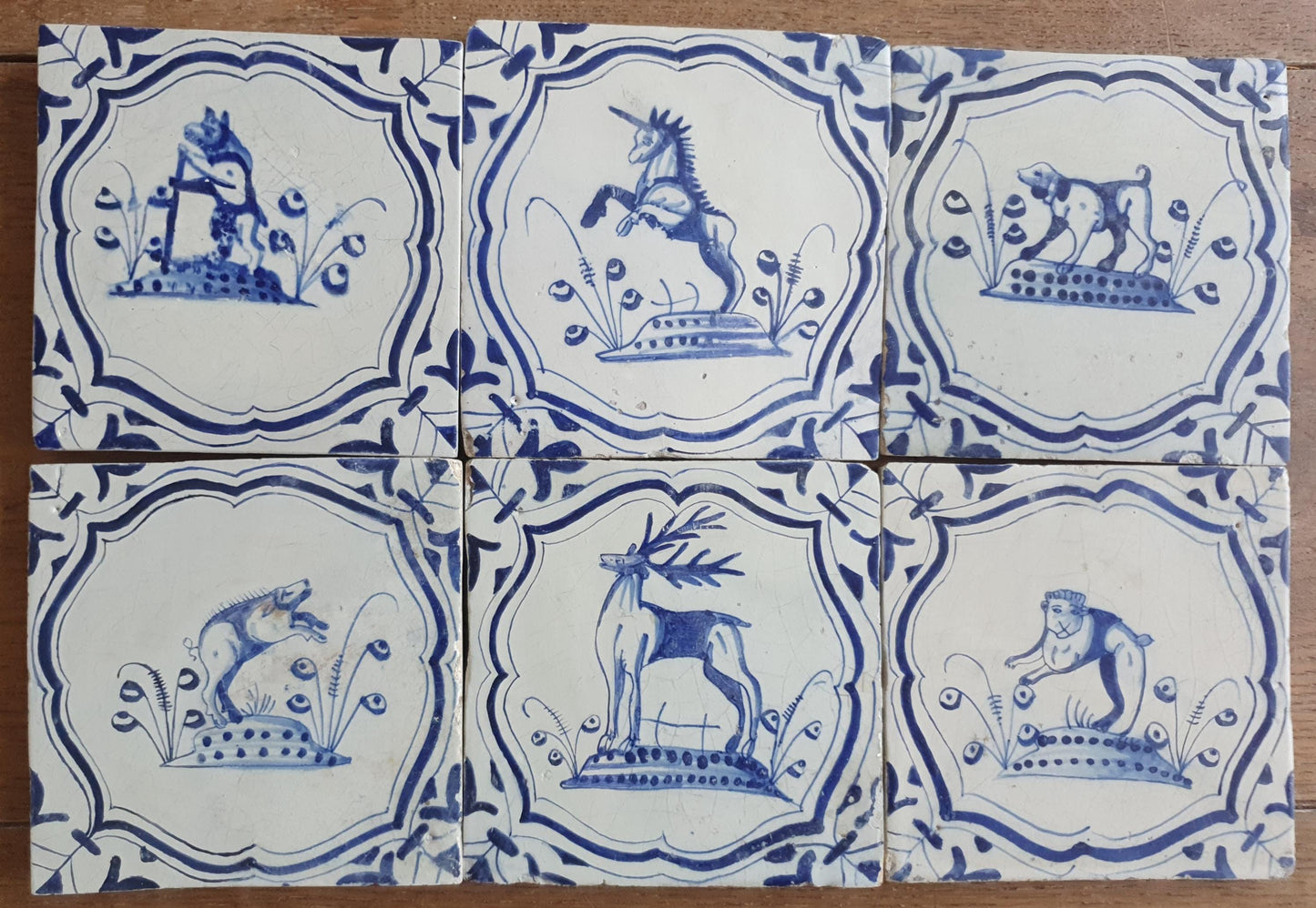 6 x Dutch rare Tiles, representing animals which are captured in an accolade shaped border with 'winged-leaf' corner motifs.