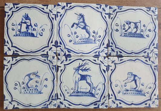 6 x Dutch rare Tiles, representing animals which are captured in an accolade shaped border with 'winged-leaf' corner motifs.