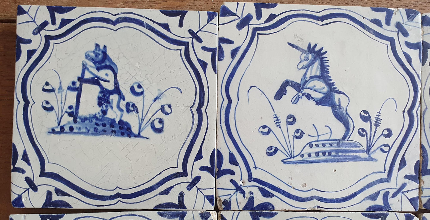 6 x Dutch rare Tiles, representing animals which are captured in an accolade shaped border with 'winged-leaf' corner motifs.