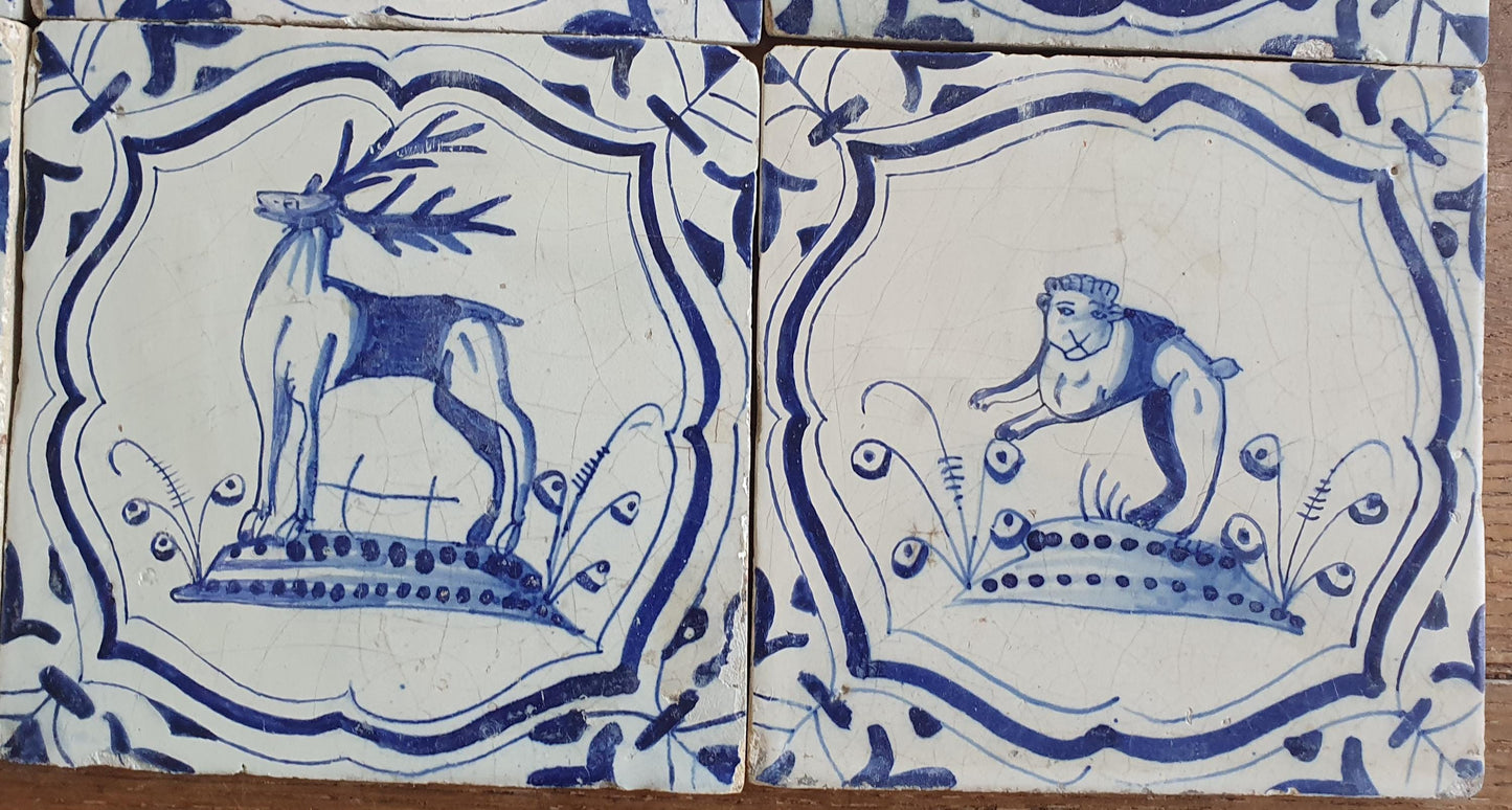 6 x Dutch rare Tiles, representing animals which are captured in an accolade shaped border with 'winged-leaf' corner motifs.