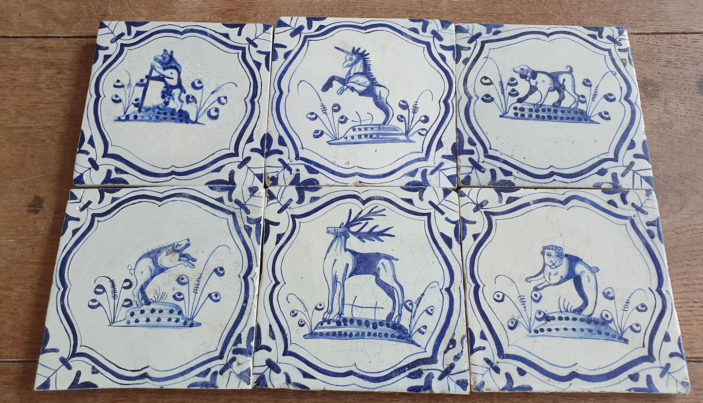 6 x Dutch rare Tiles, representing animals which are captured in an accolade shaped border with 'winged-leaf' corner motifs.