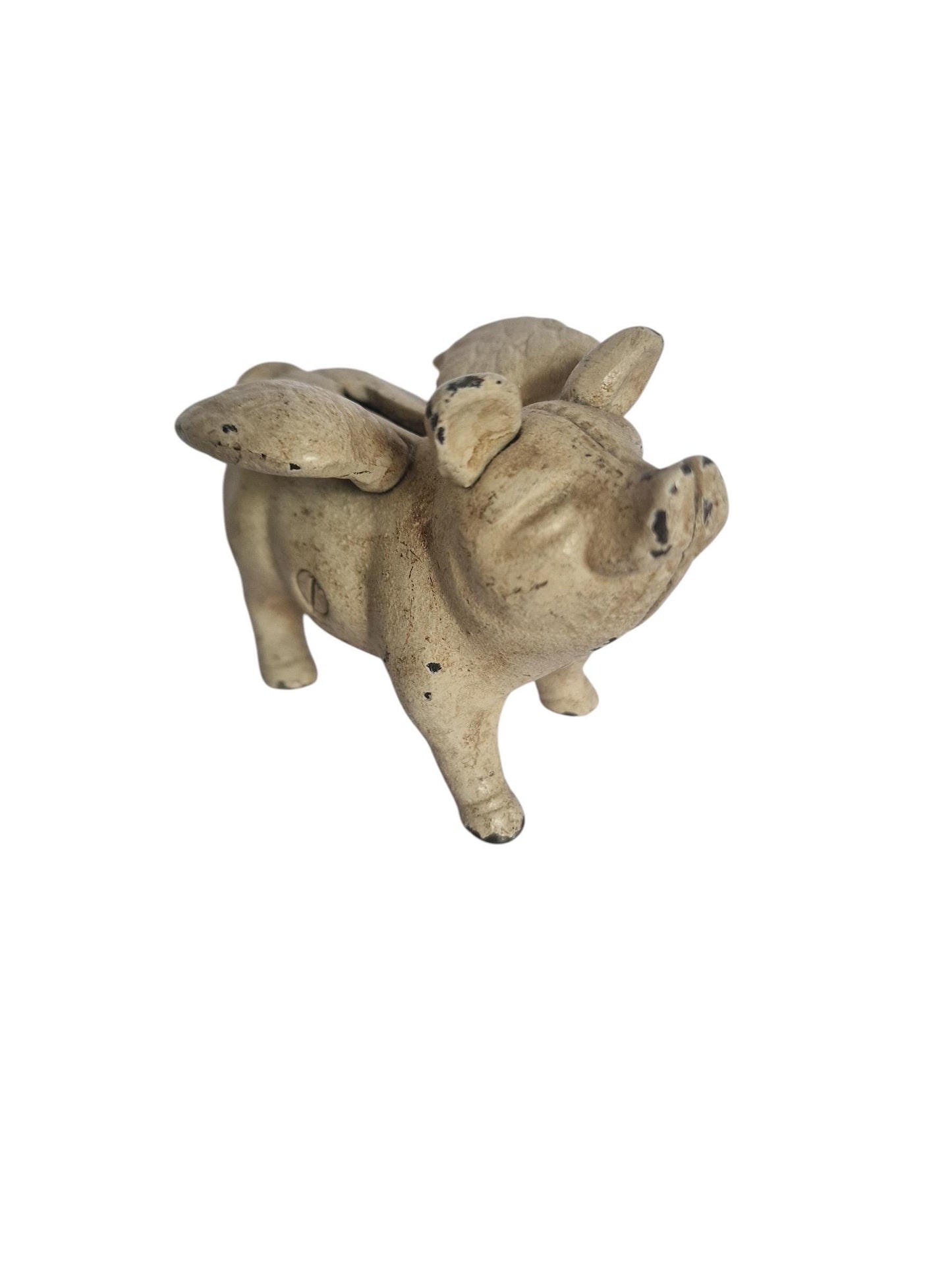Vintage cast iron flying pig coin bank.
