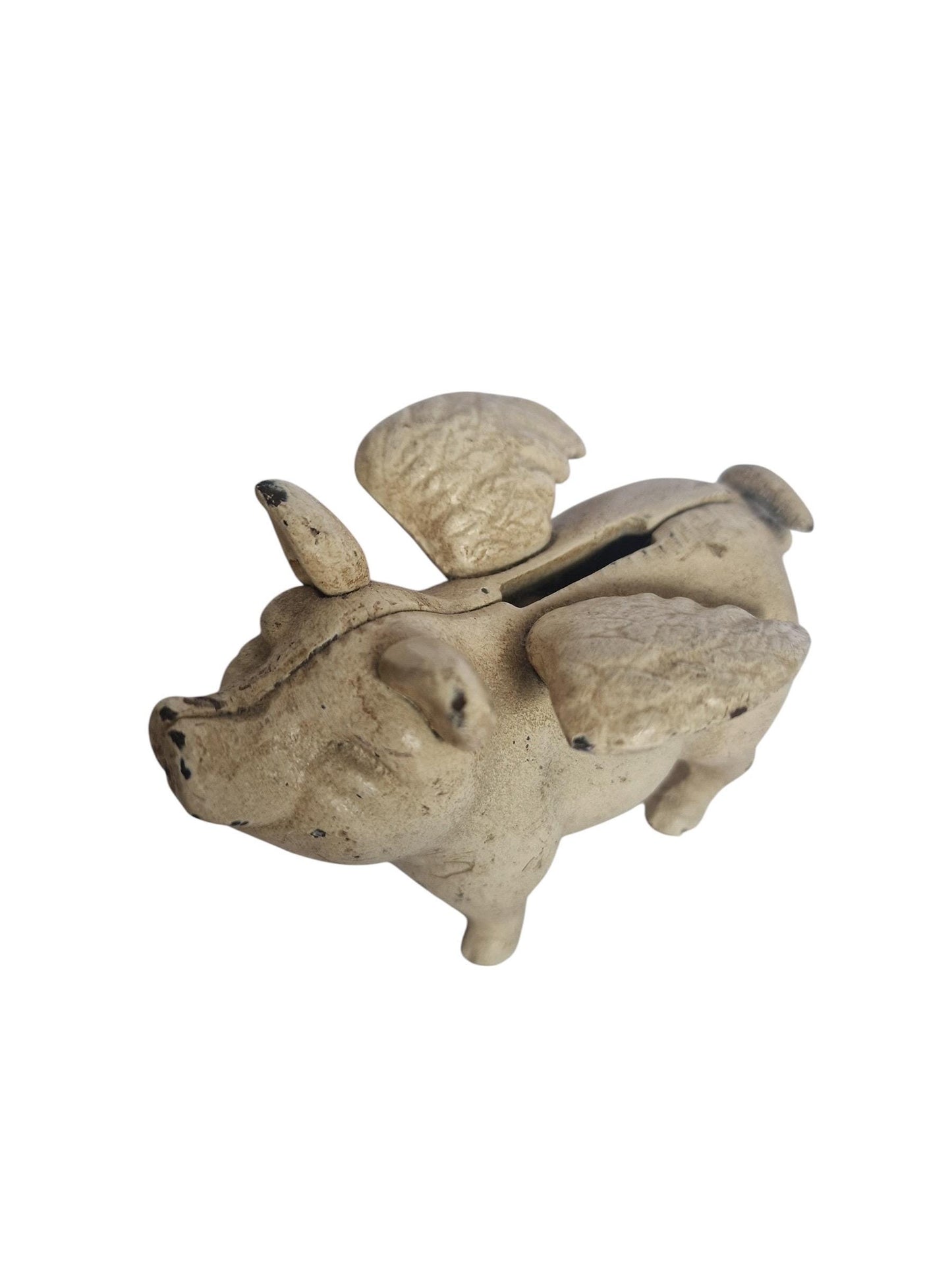 Vintage cast iron flying pig coin bank.