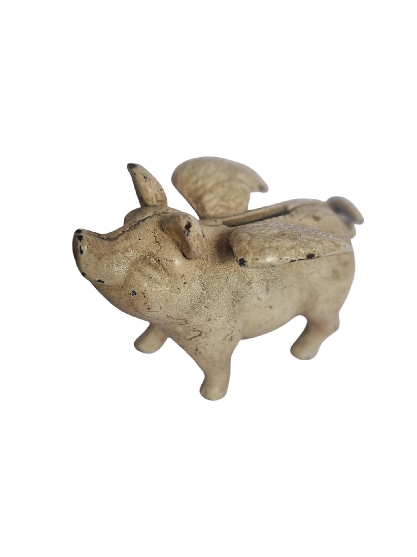Vintage cast iron flying pig coin bank.