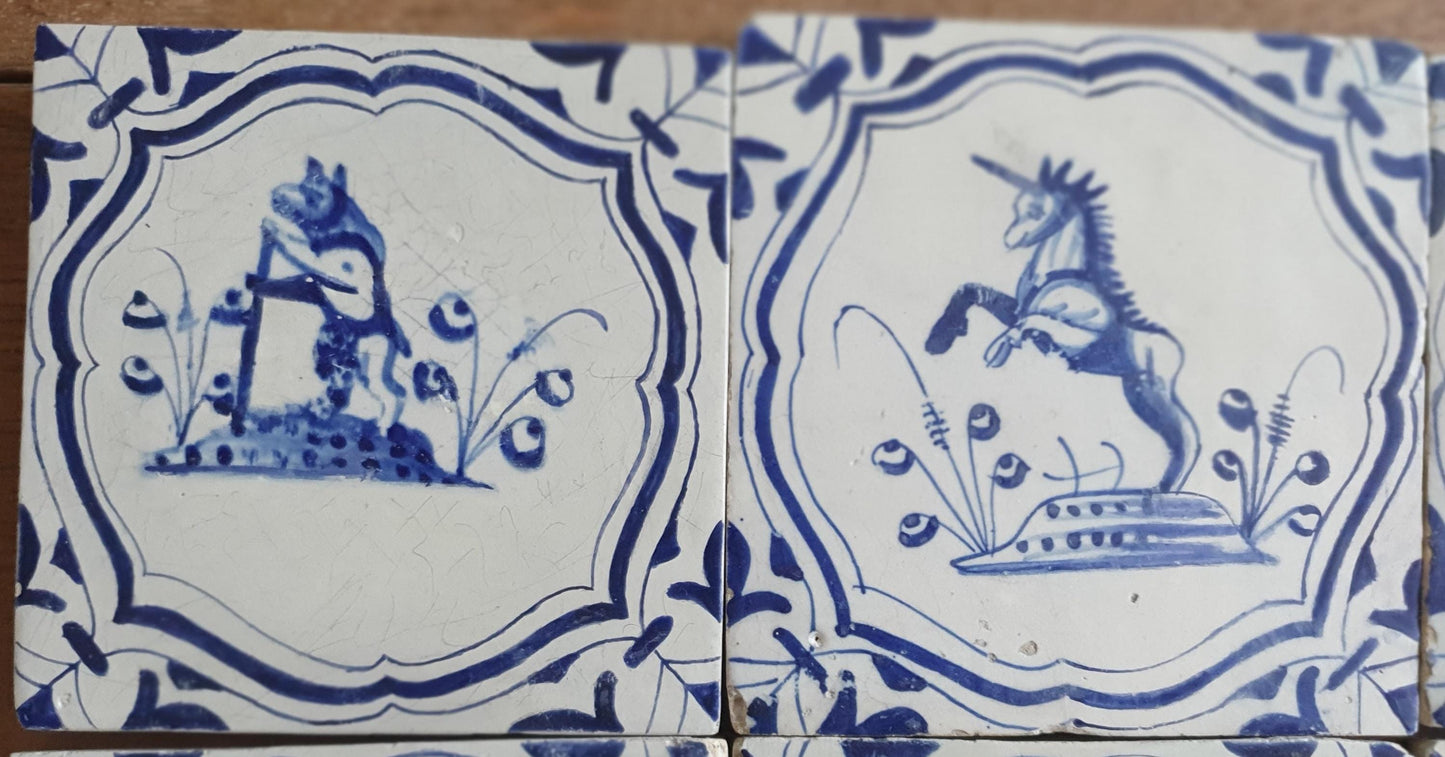 6 x Dutch rare Tiles, representing animals which are captured in an accolade shaped border with 'winged-leaf' corner motifs.