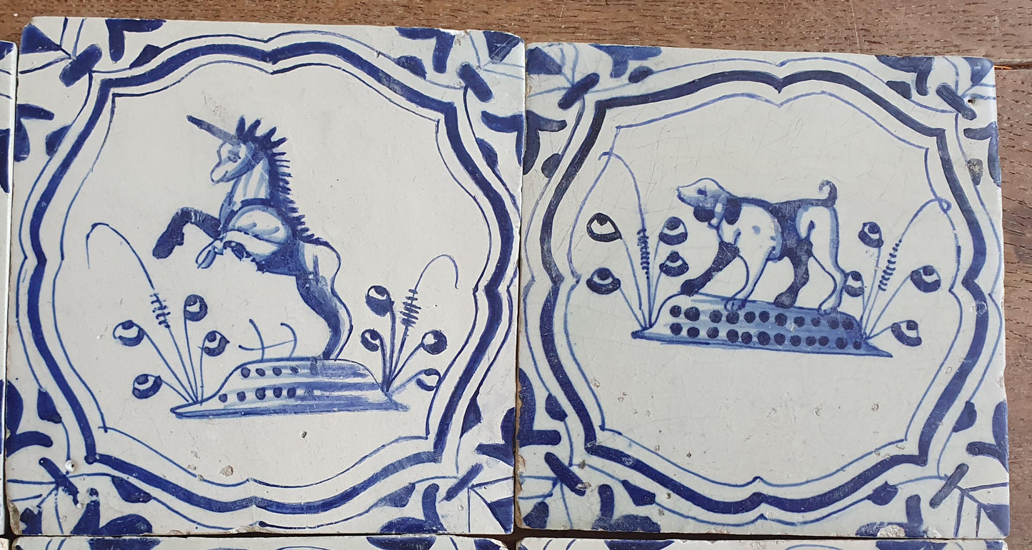 6 x Dutch rare Tiles, representing animals which are captured in an accolade shaped border with 'winged-leaf' corner motifs.