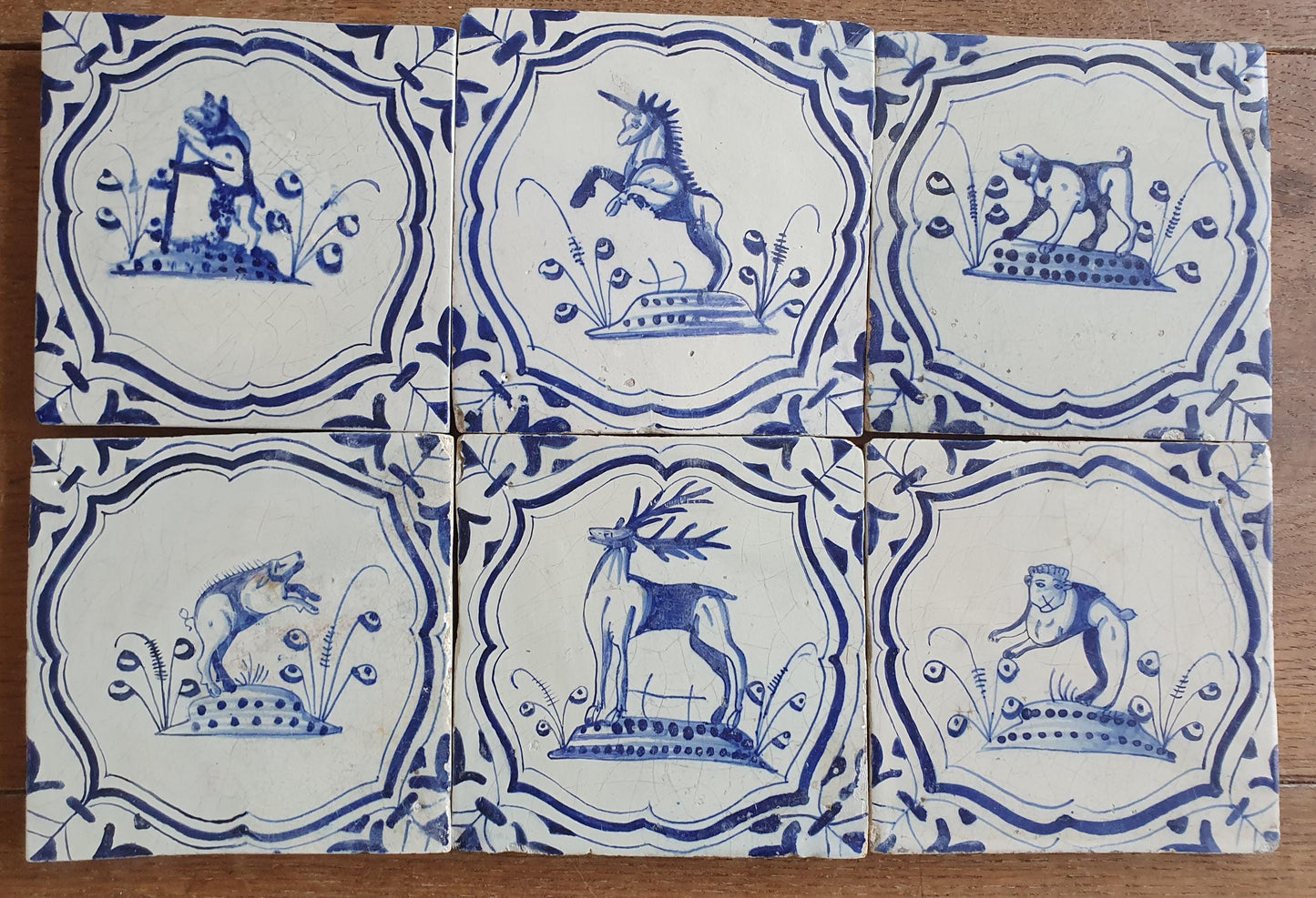 6 x Dutch rare Tiles, representing animals which are captured in an accolade shaped border with 'winged-leaf' corner motifs.