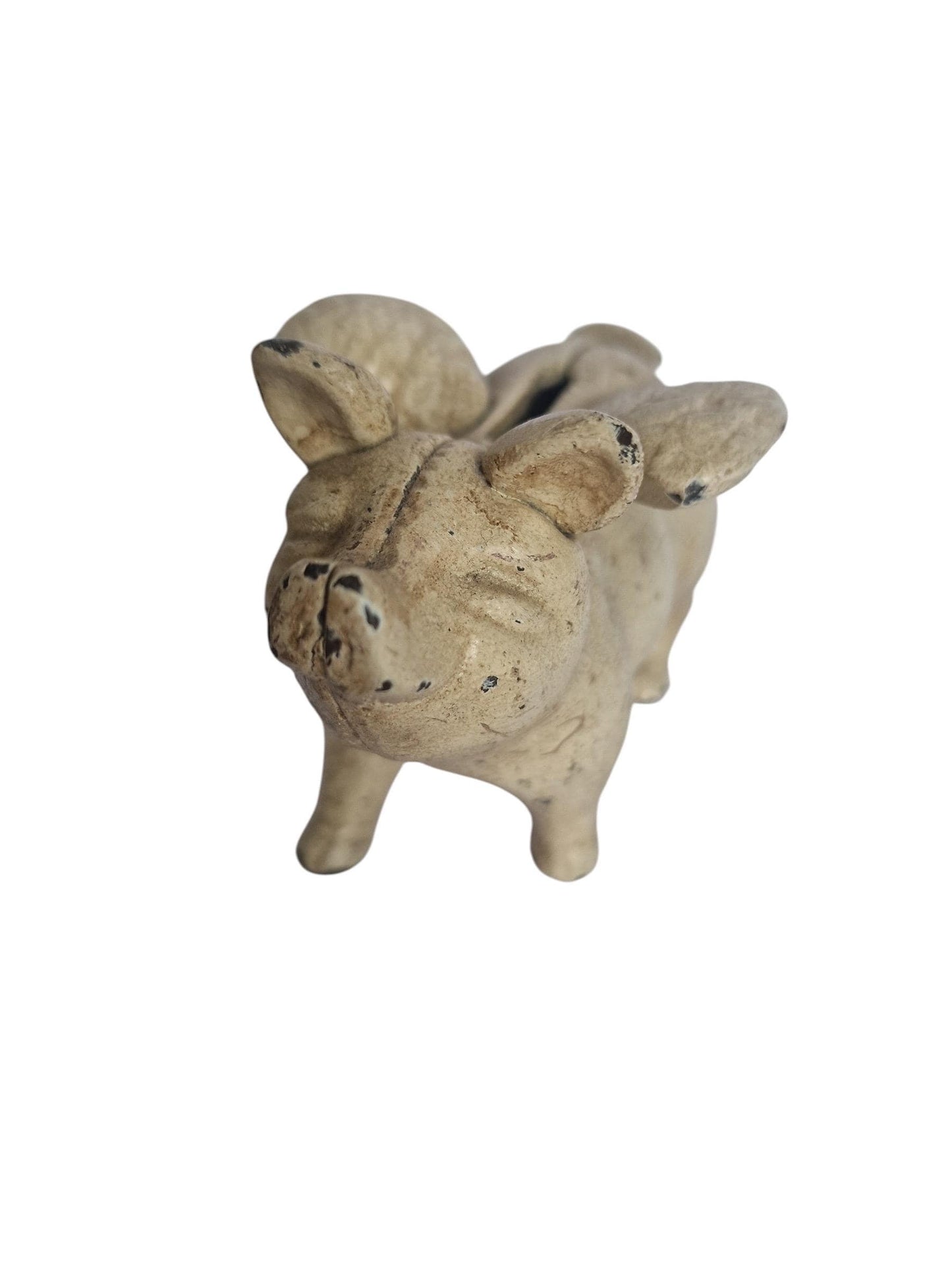 Vintage cast iron flying pig coin bank.