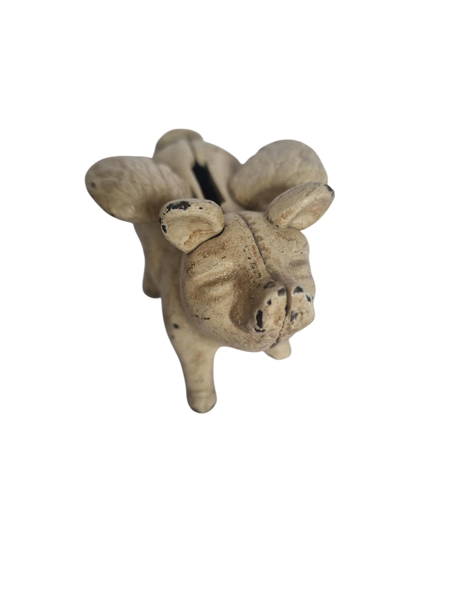 Vintage cast iron flying pig coin bank.