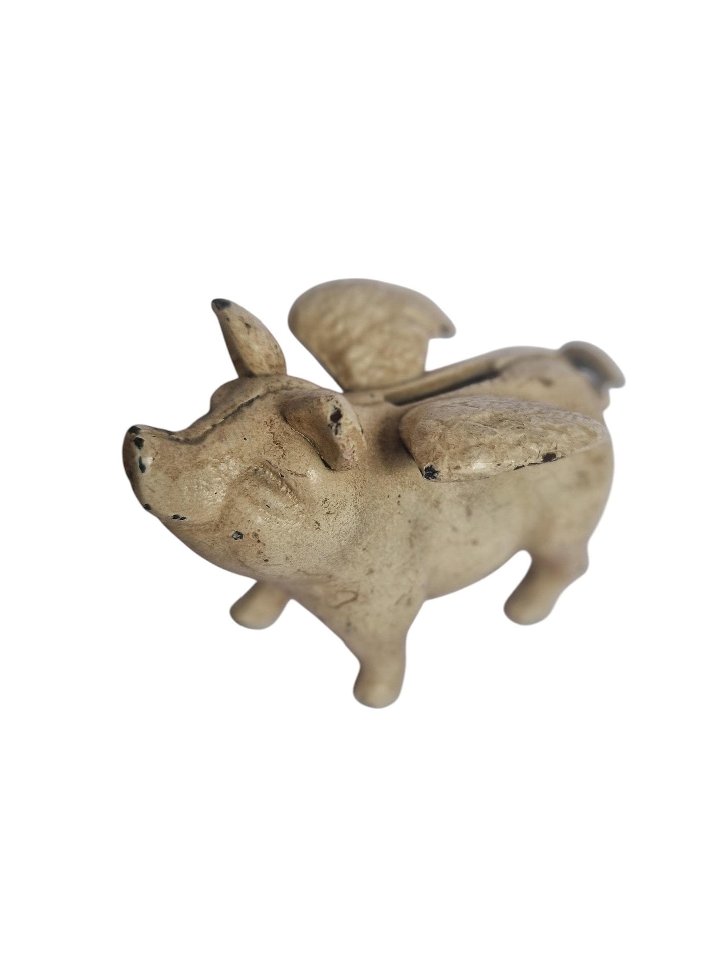 Vintage cast iron flying pig coin bank.