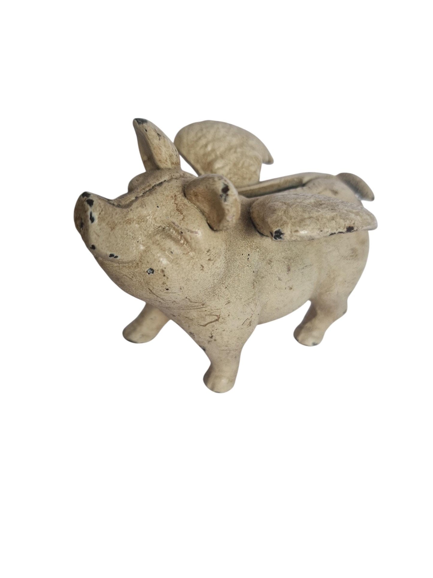 Vintage cast iron flying pig coin bank.
