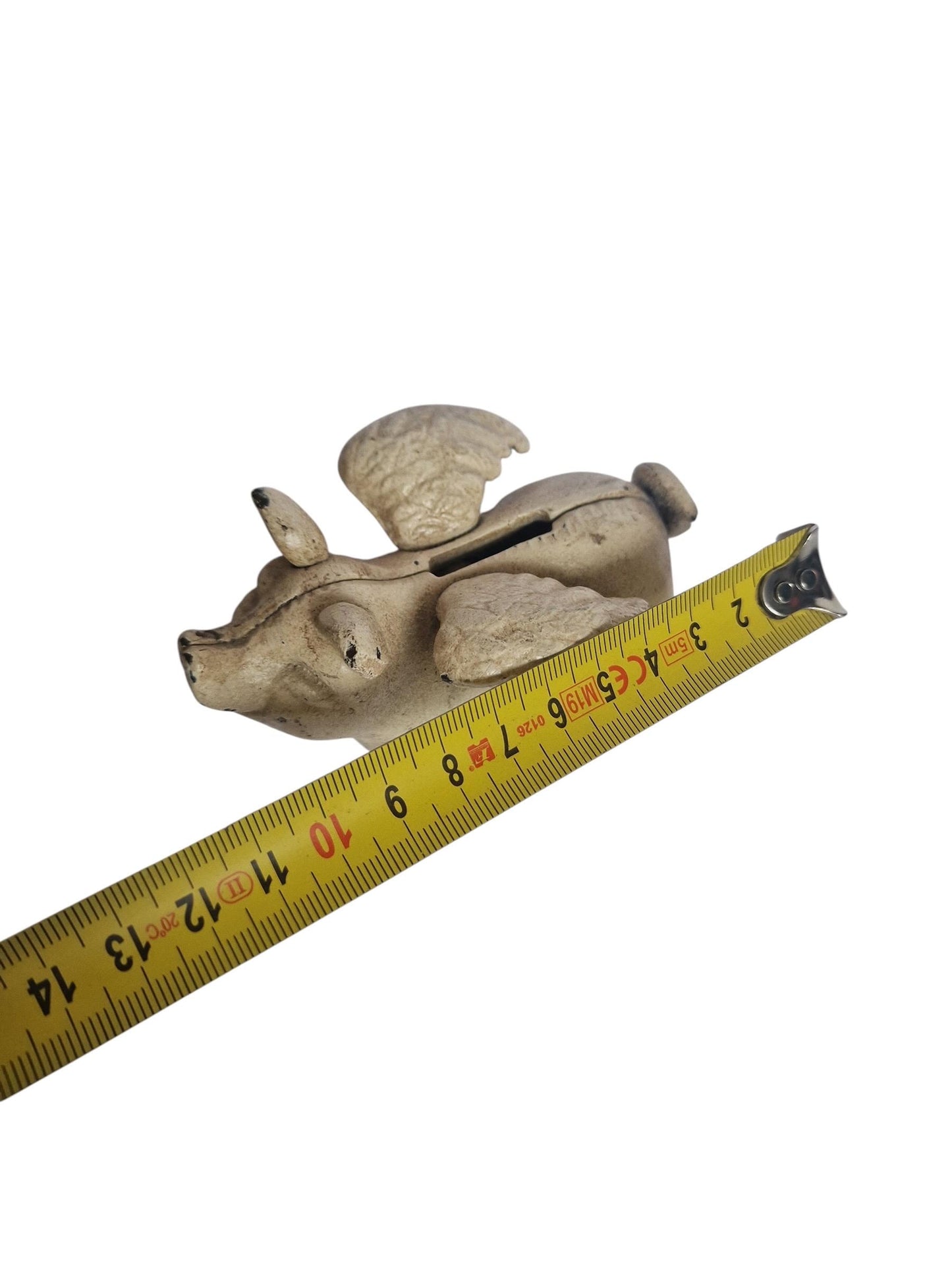 Vintage cast iron flying pig coin bank.