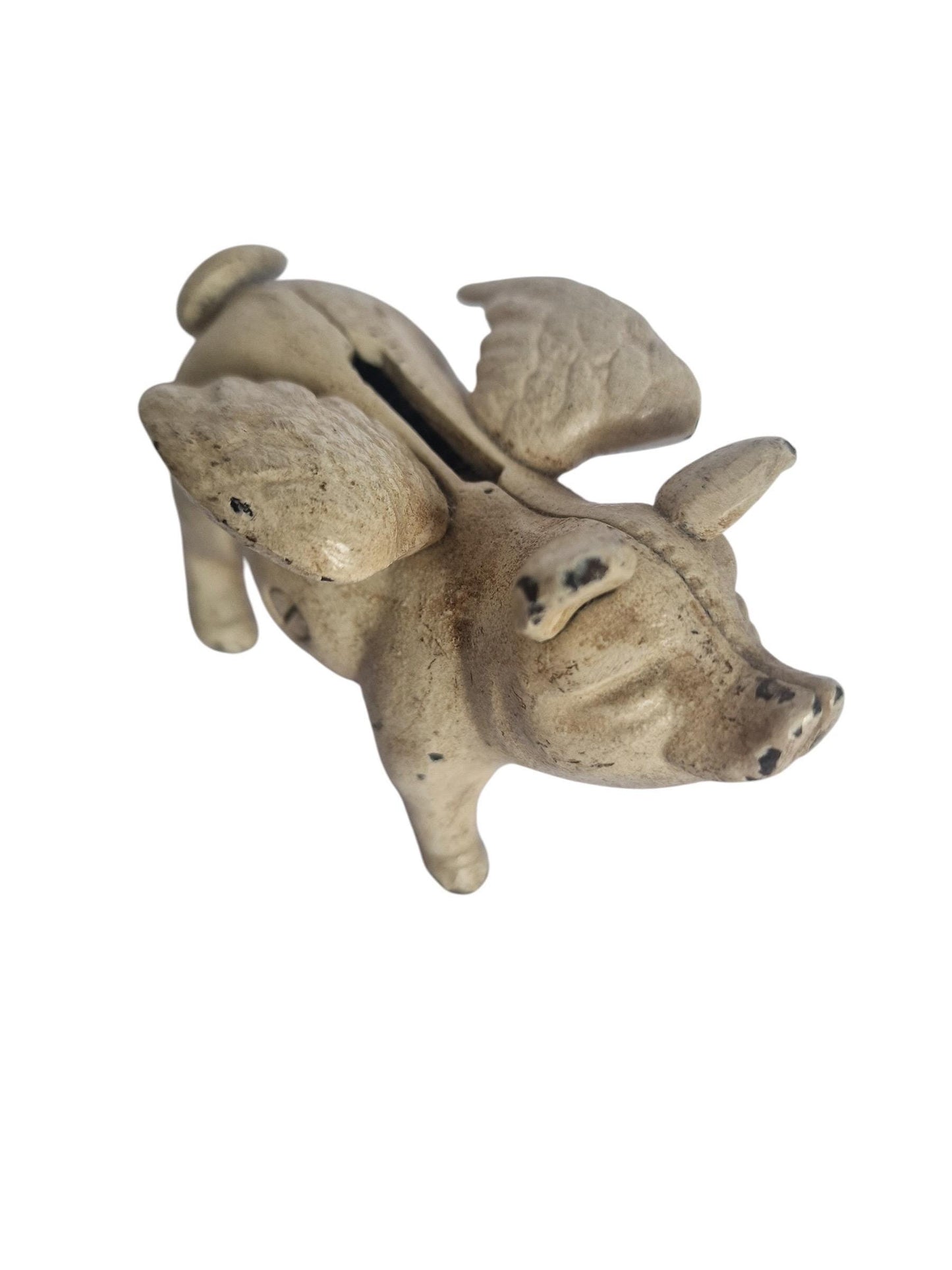 Vintage cast iron flying pig coin bank.