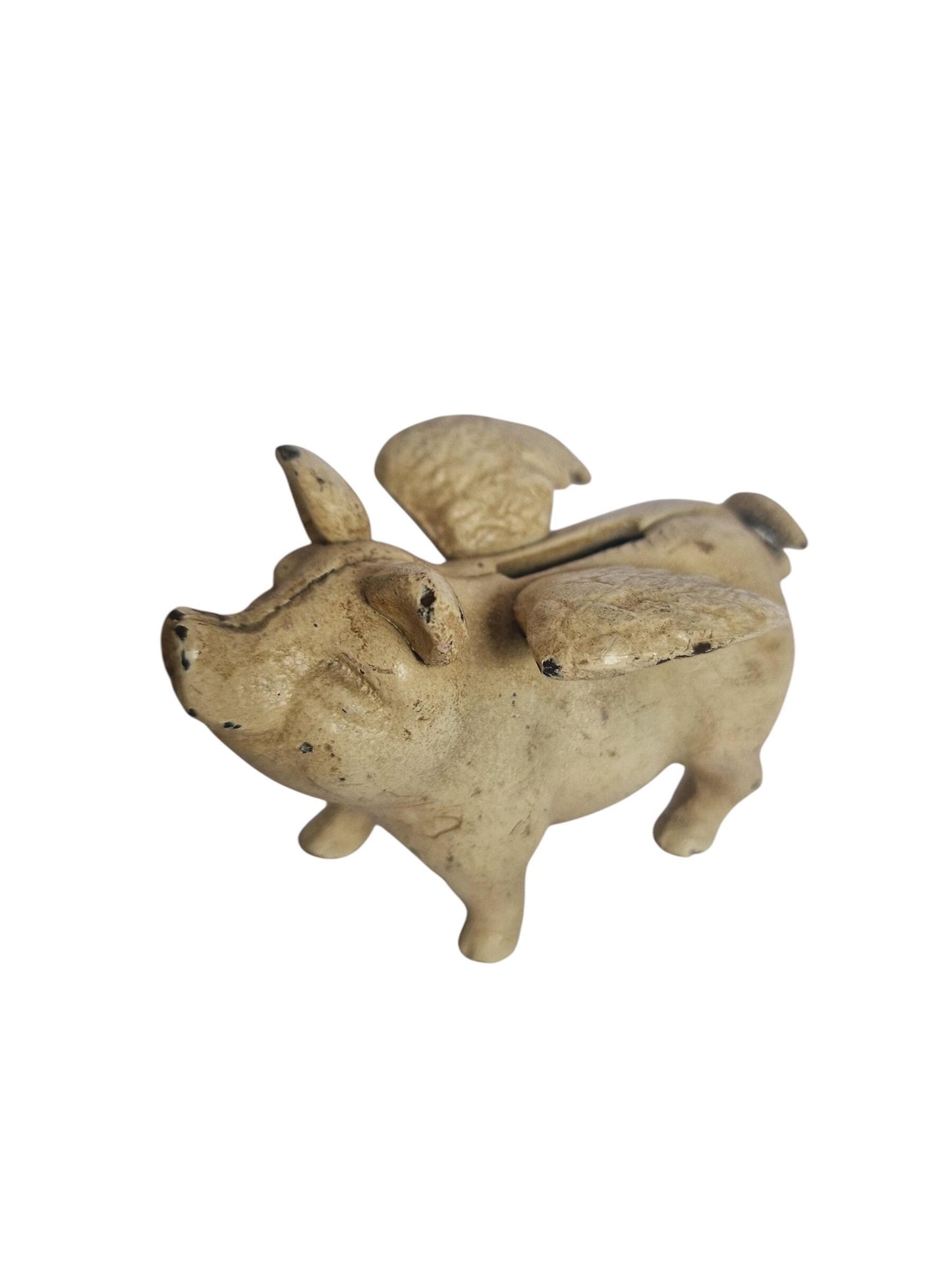 Vintage cast iron flying pig coin bank.