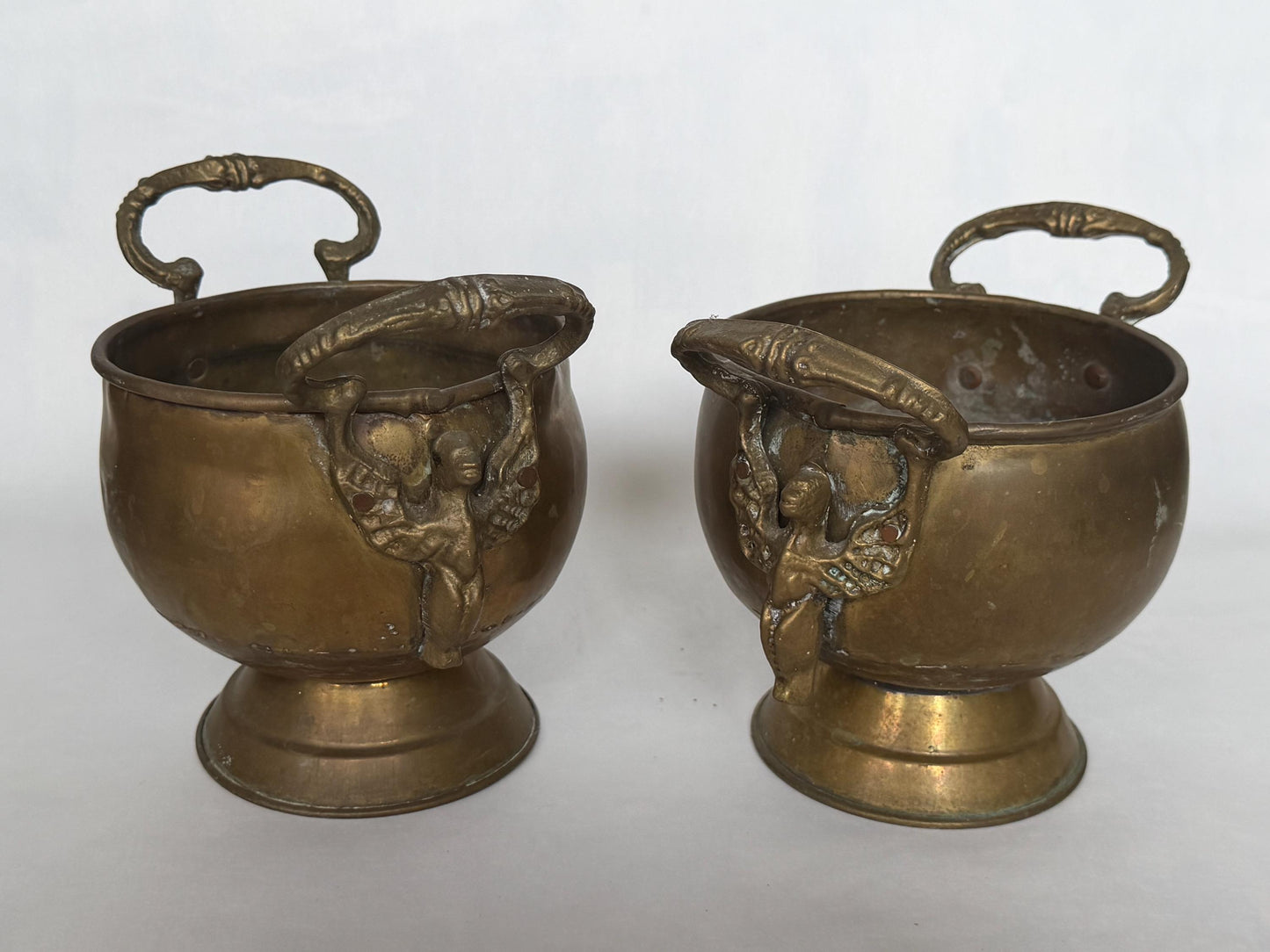 Antique Pair of Art Nouveau Cachepots with Mythical Winged Siren Handles c.1900–1920, set planters in red and yellow copper and brass