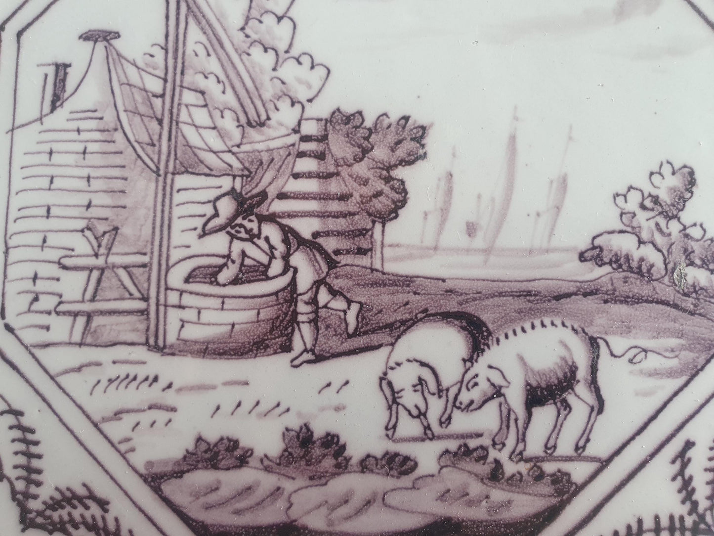 Delft tile, man and two pigs 18th century (c. 1760) Dutchmanganese tile . ( Animal tile )