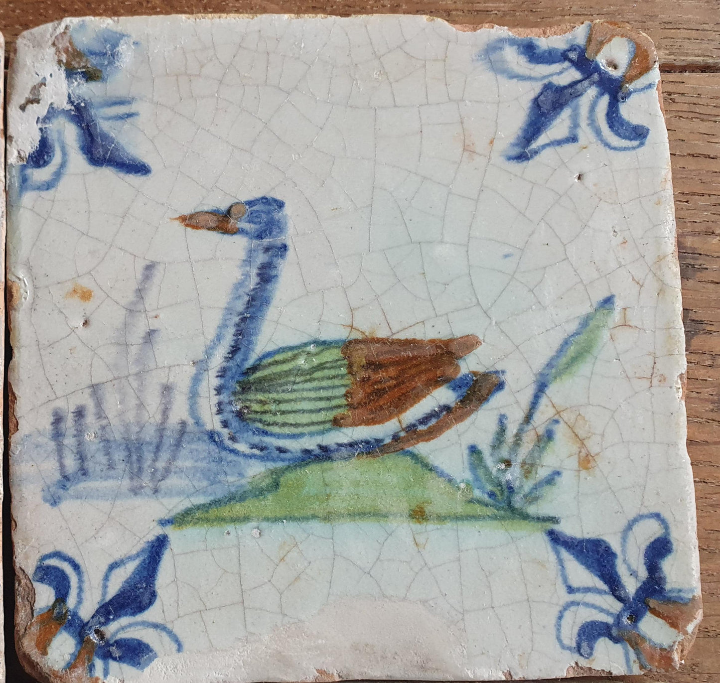 4 x Antique Delft tiles with colorful  birds. The tiles are decorated  (animaltile).