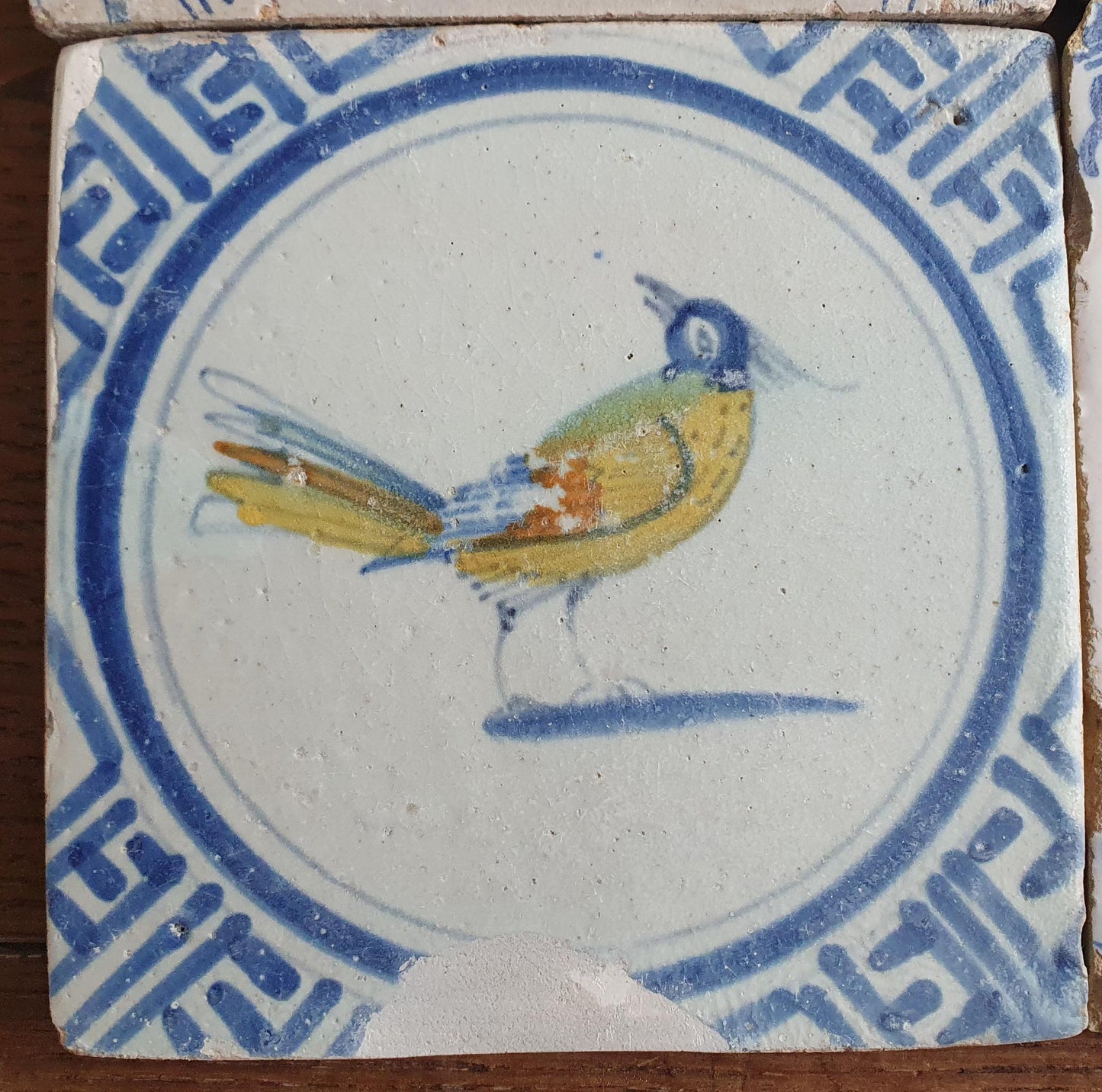 4 x Antique Delft tiles with colorful  birds. The tiles are decorated  (animaltile).