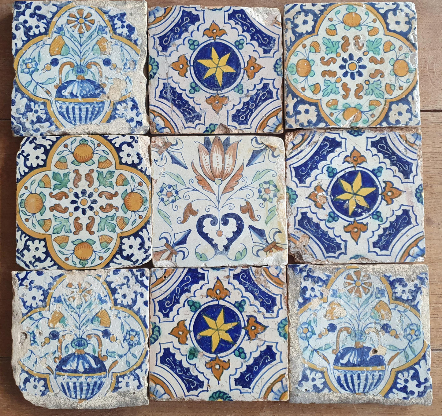 9 x Antique Delft tiles with colorful  ornament tiles.