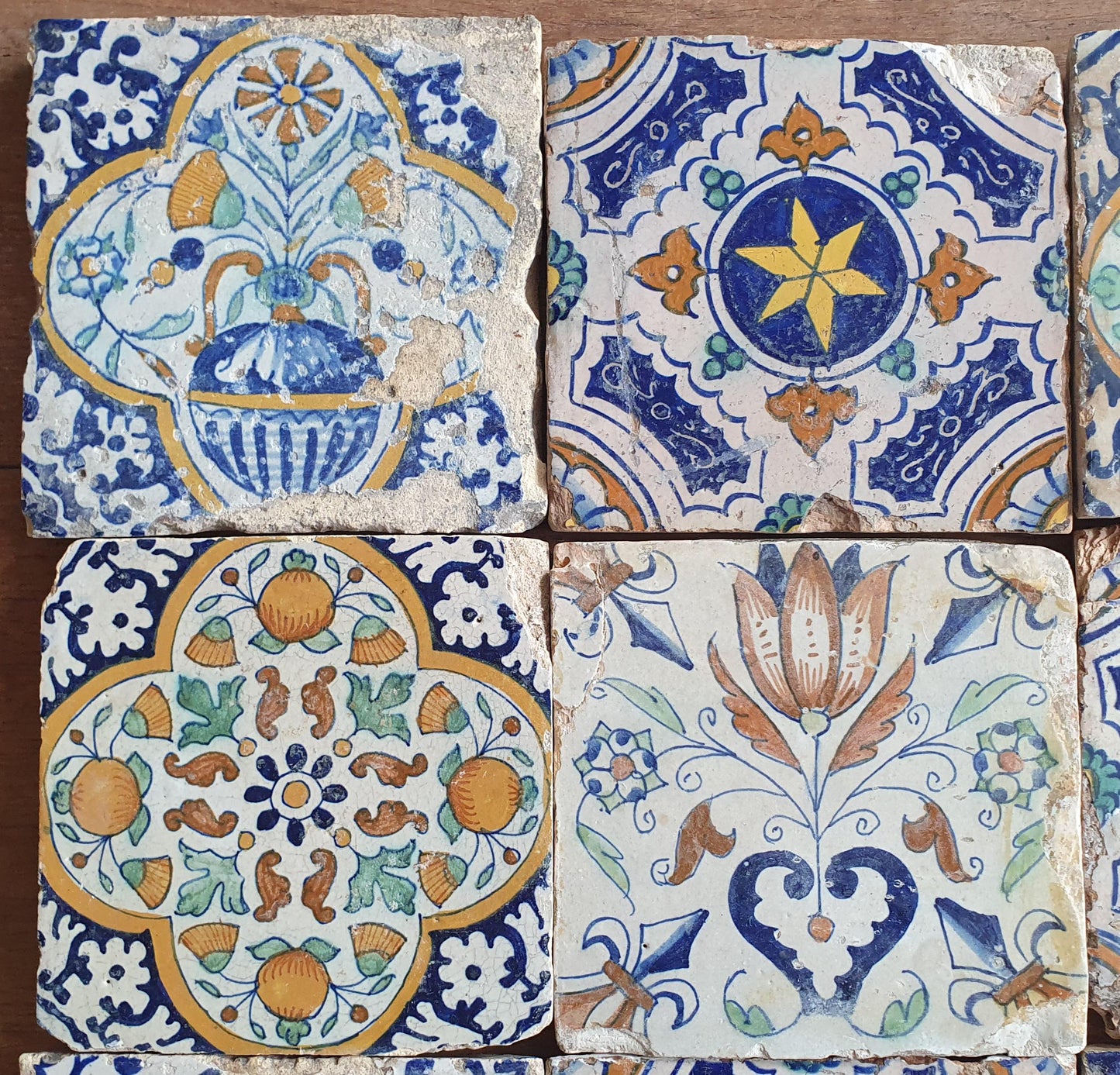 9 x Antique Delft tiles with colorful  ornament tiles.