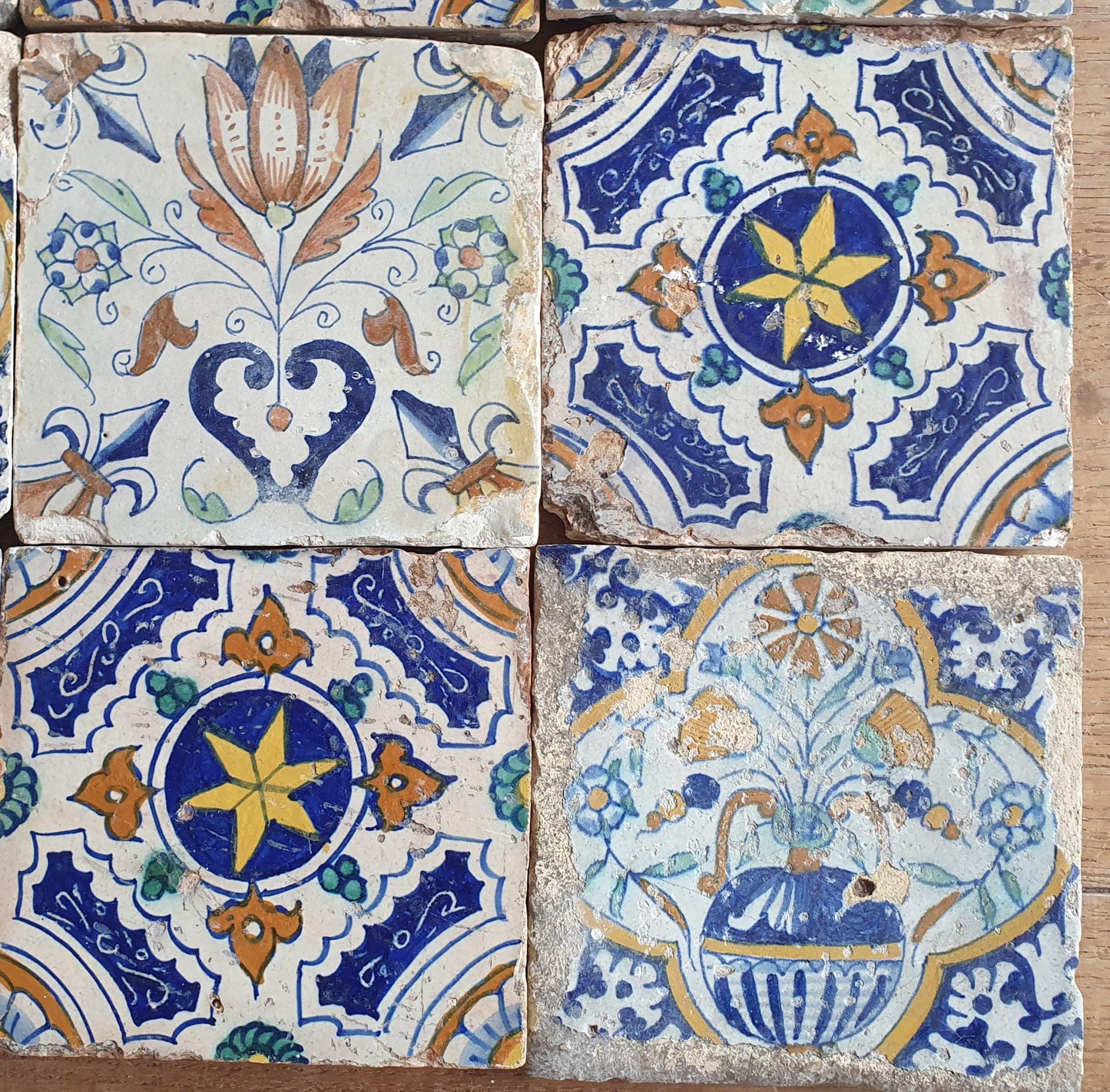 9 x Antique Delft tiles with colorful  ornament tiles.