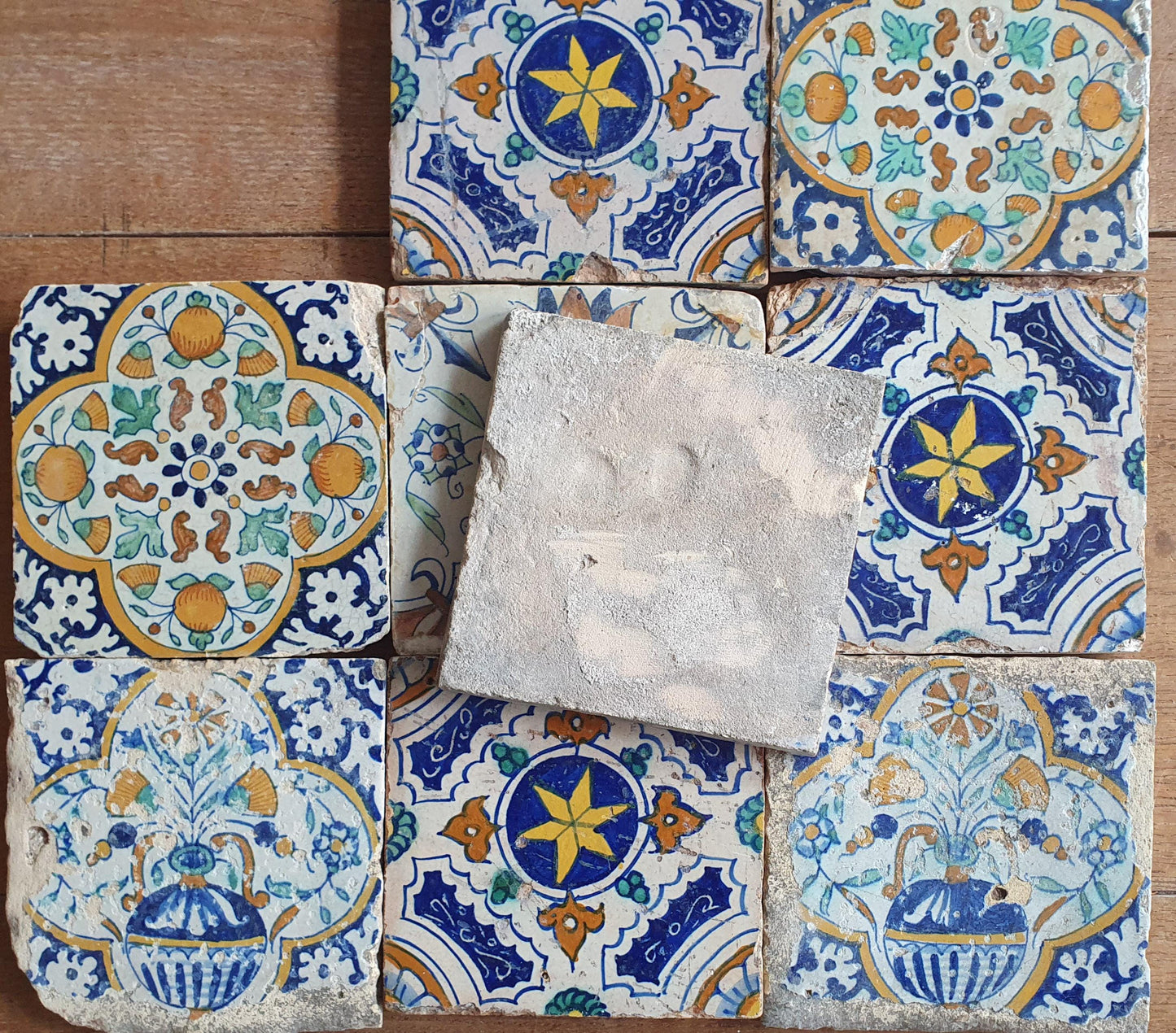 9 x Antique Delft tiles with colorful  ornament tiles.