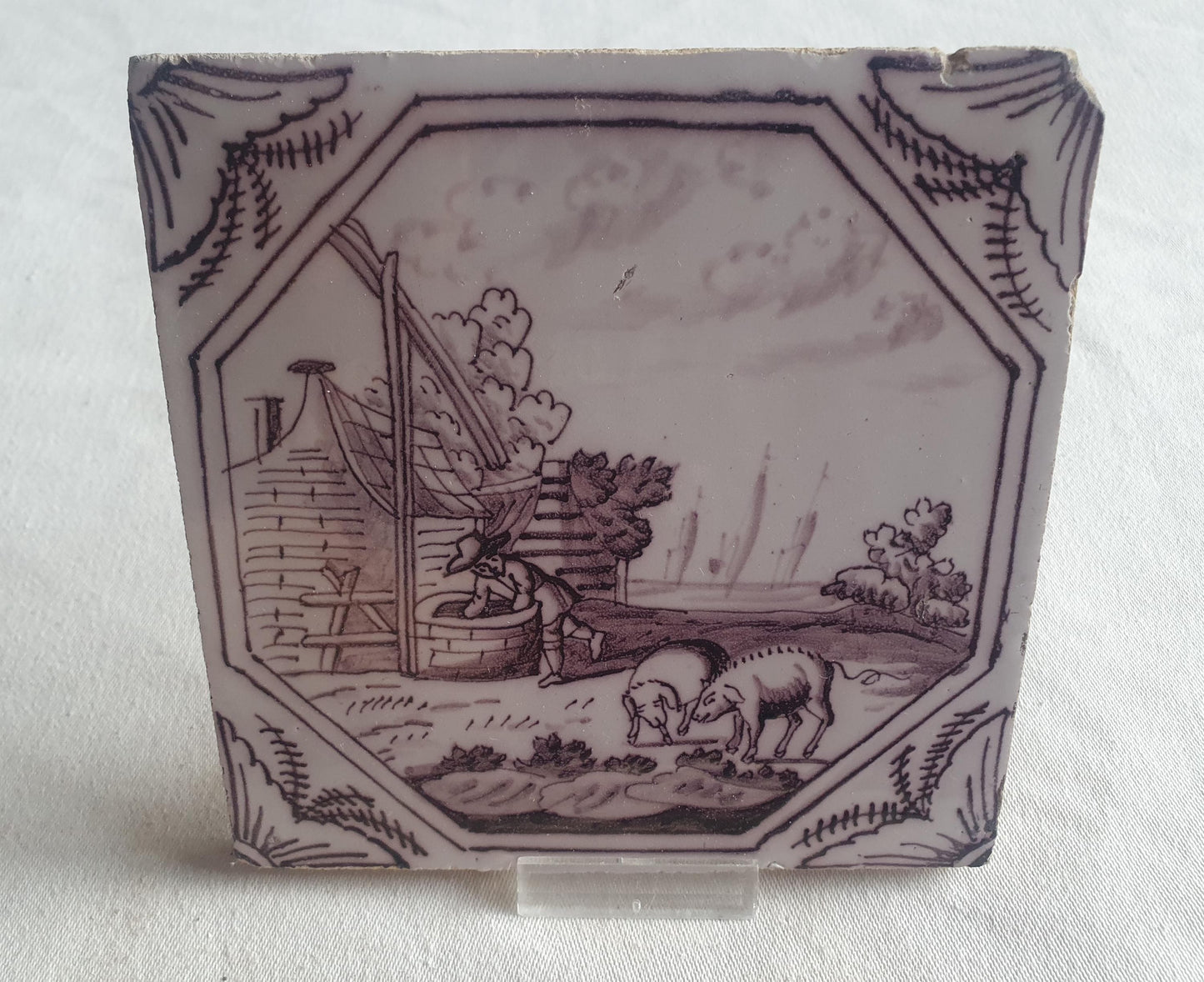 Delft tile, man and two pigs 18th century (c. 1760) Dutchmanganese tile . ( Animal tile )