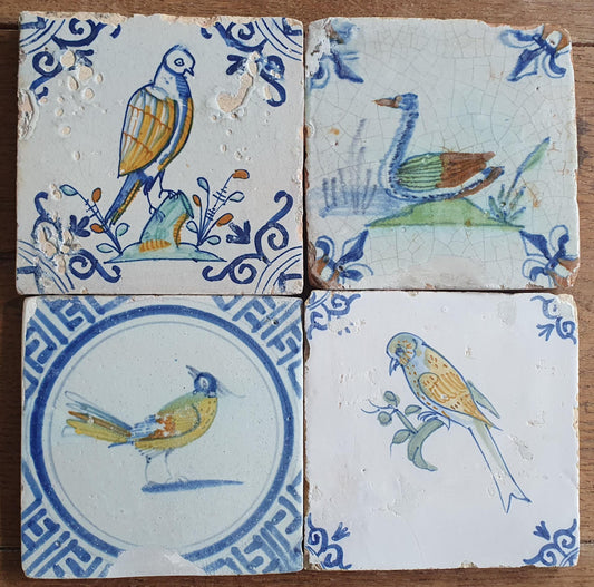 4 x Antique Delft tiles with colorful  birds. The tiles are decorated  (animaltile).