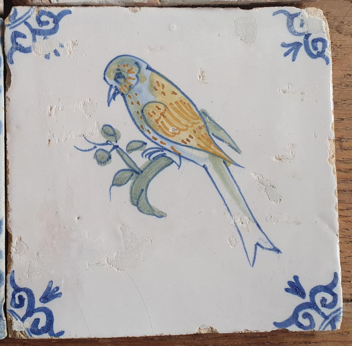 4 x Antique Delft tiles with colorful  birds. The tiles are decorated  (animaltile).
