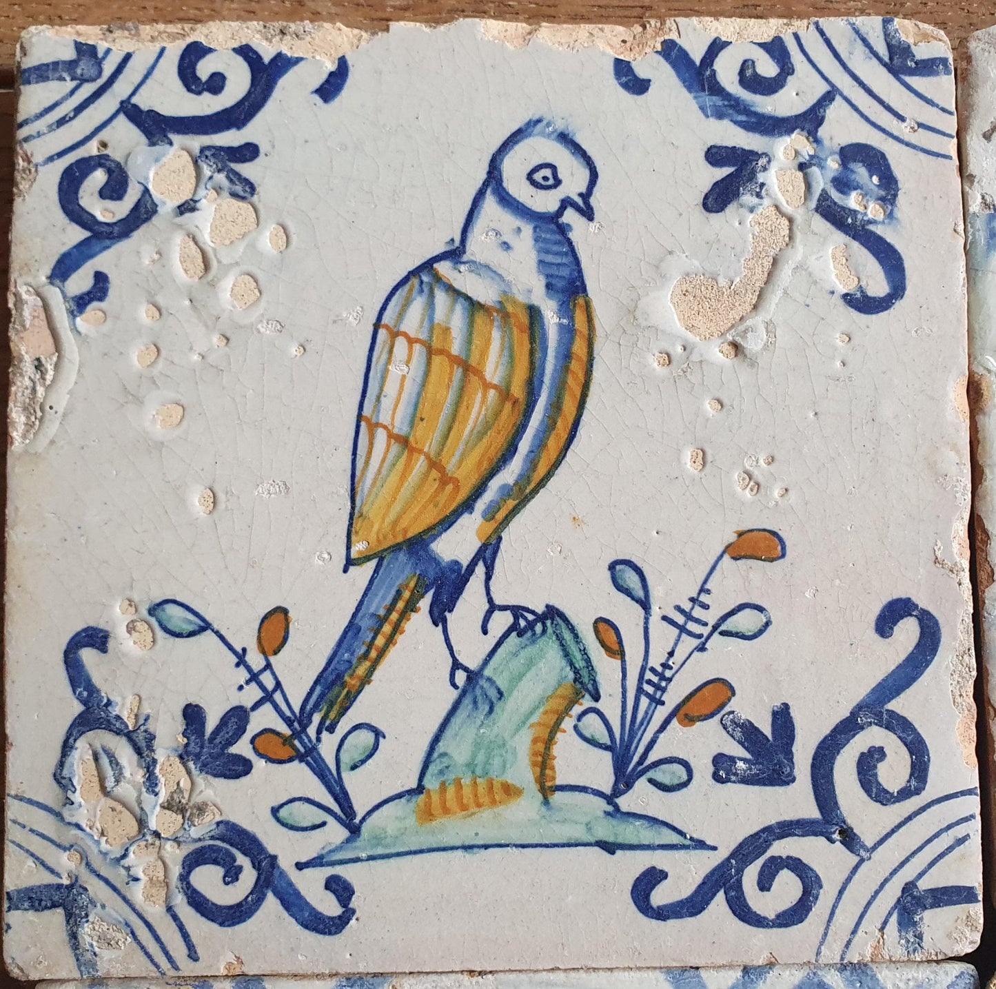 4 x Antique Delft tiles with colorful  birds. The tiles are decorated  (animaltile).