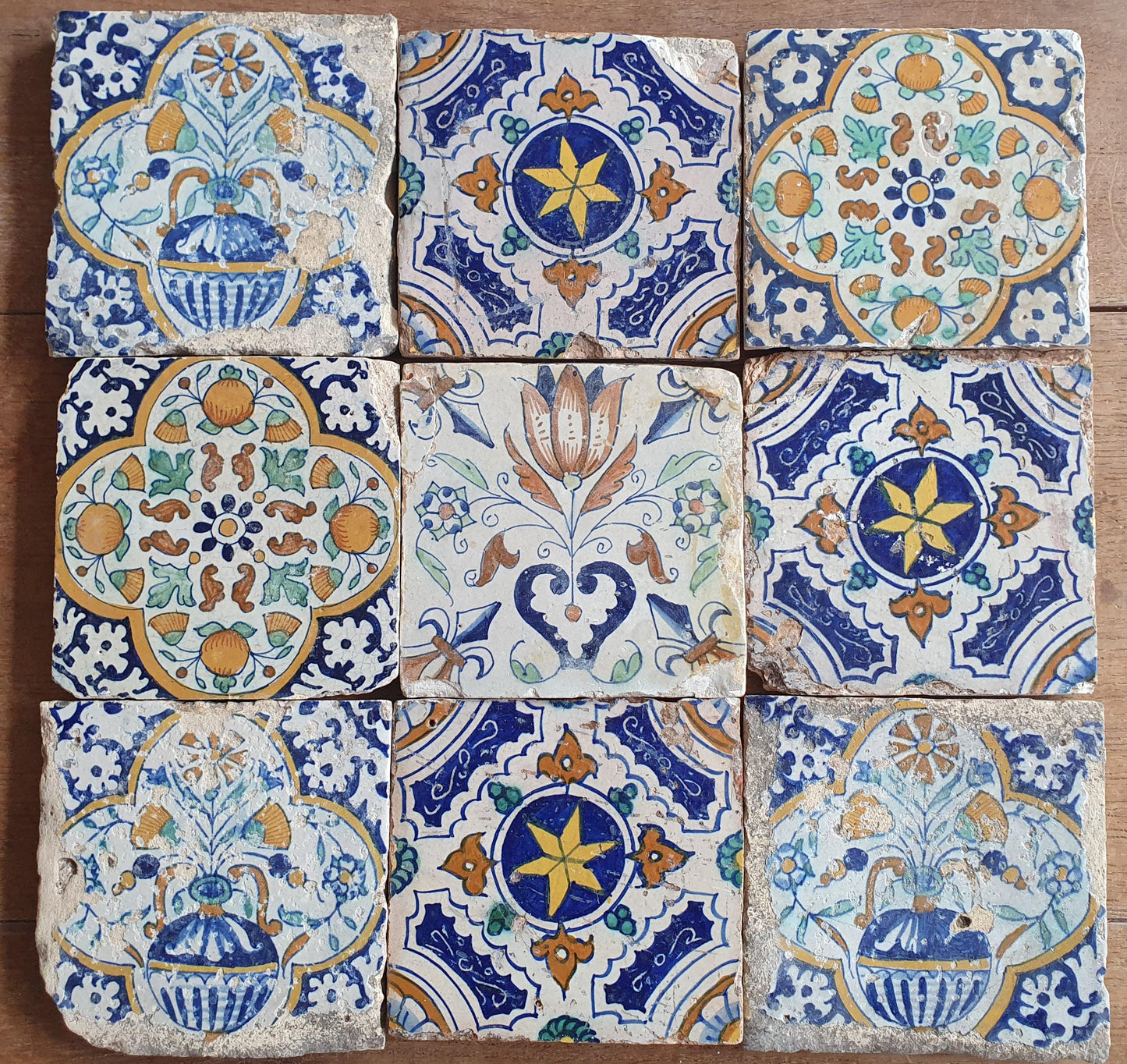 9 x Antique Delft tiles with colorful  ornament tiles.