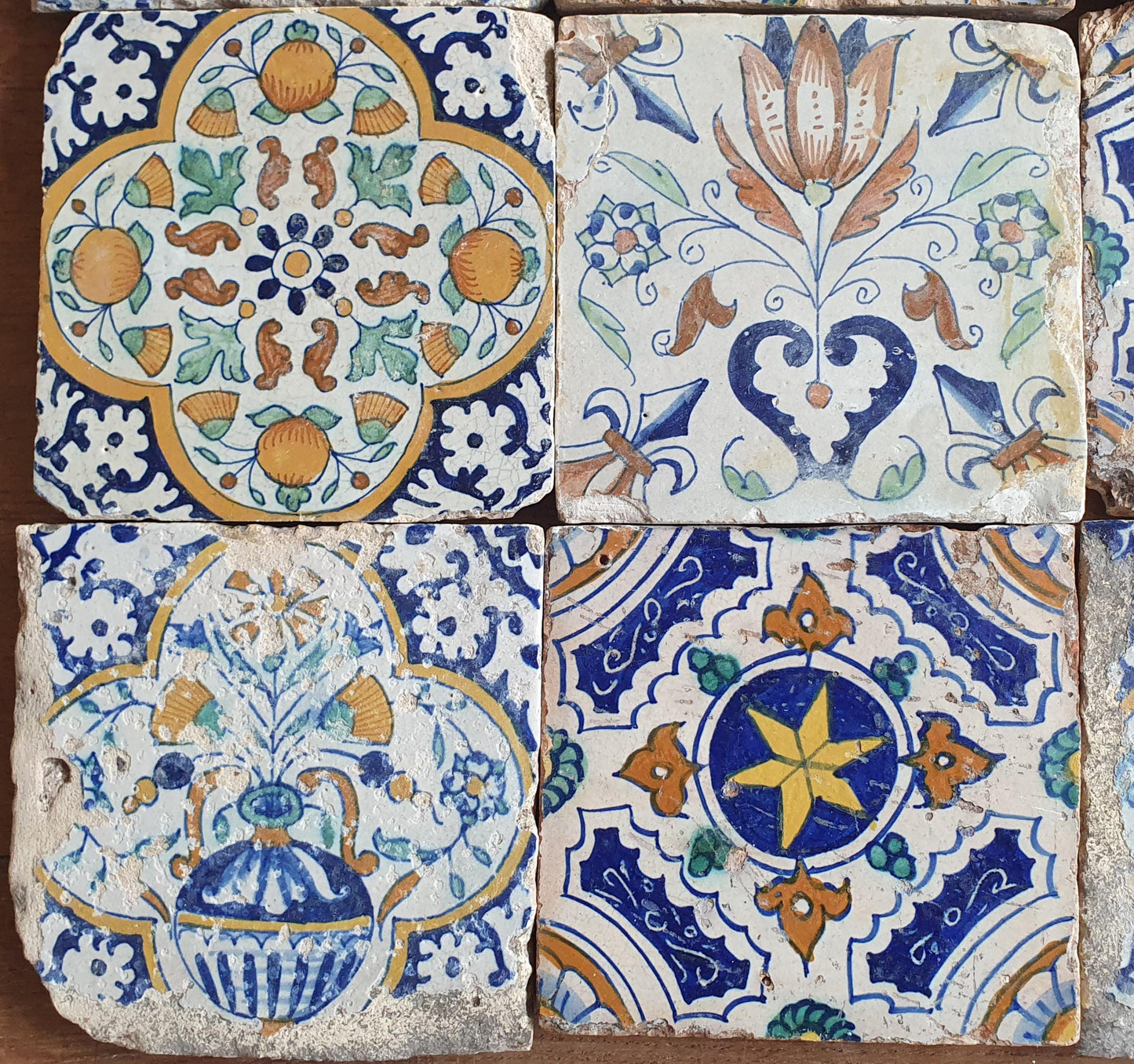 9 x Antique Delft tiles with colorful  ornament tiles.