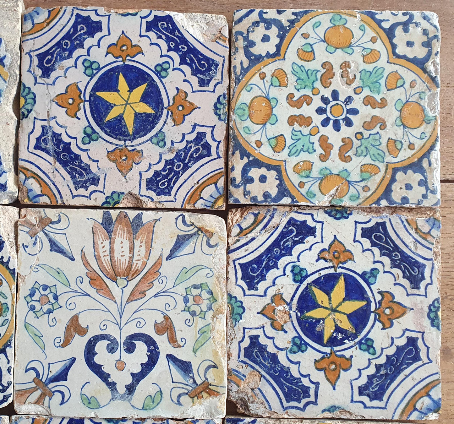 9 x Antique Delft tiles with colorful  ornament tiles.