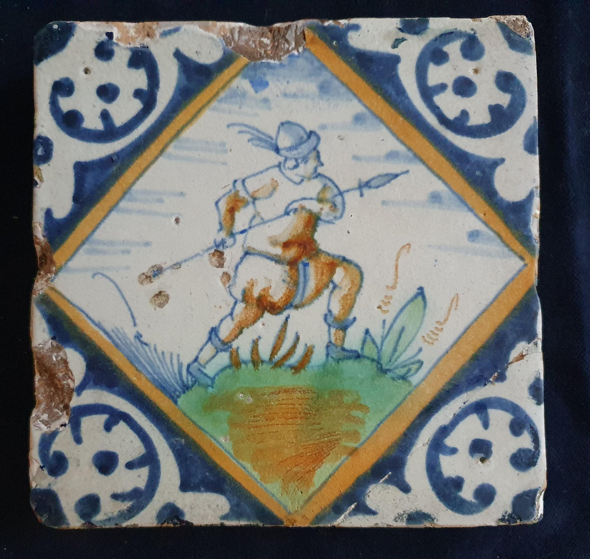 Early 17th-century (c. 1620) Delft square tile, polychrome-painted and depicting a soldier with a spear. Figuretile