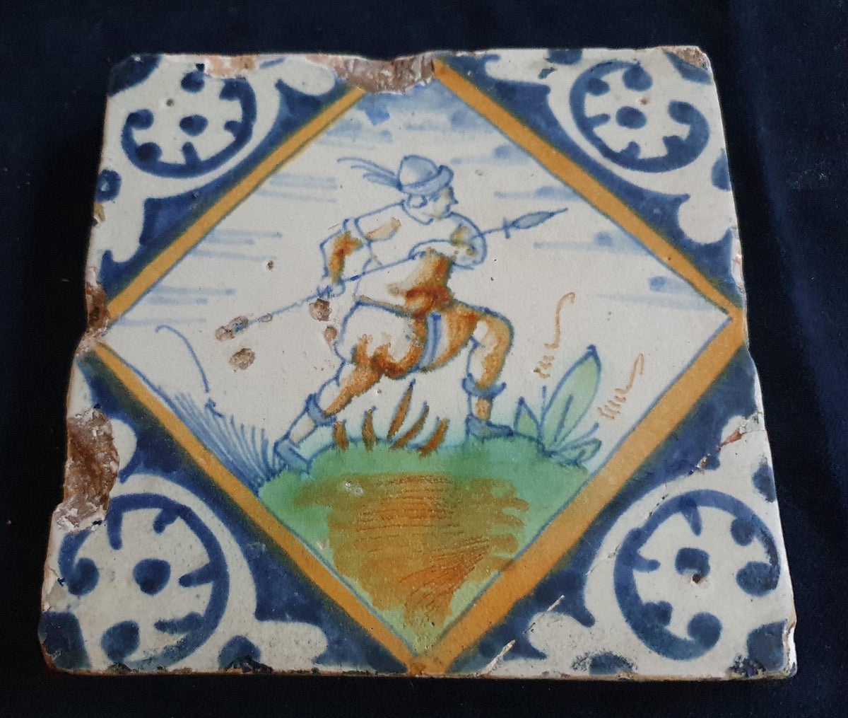 Early 17th-century (c. 1620) Delft square tile, polychrome-painted and depicting a soldier with a spear. Figuretile