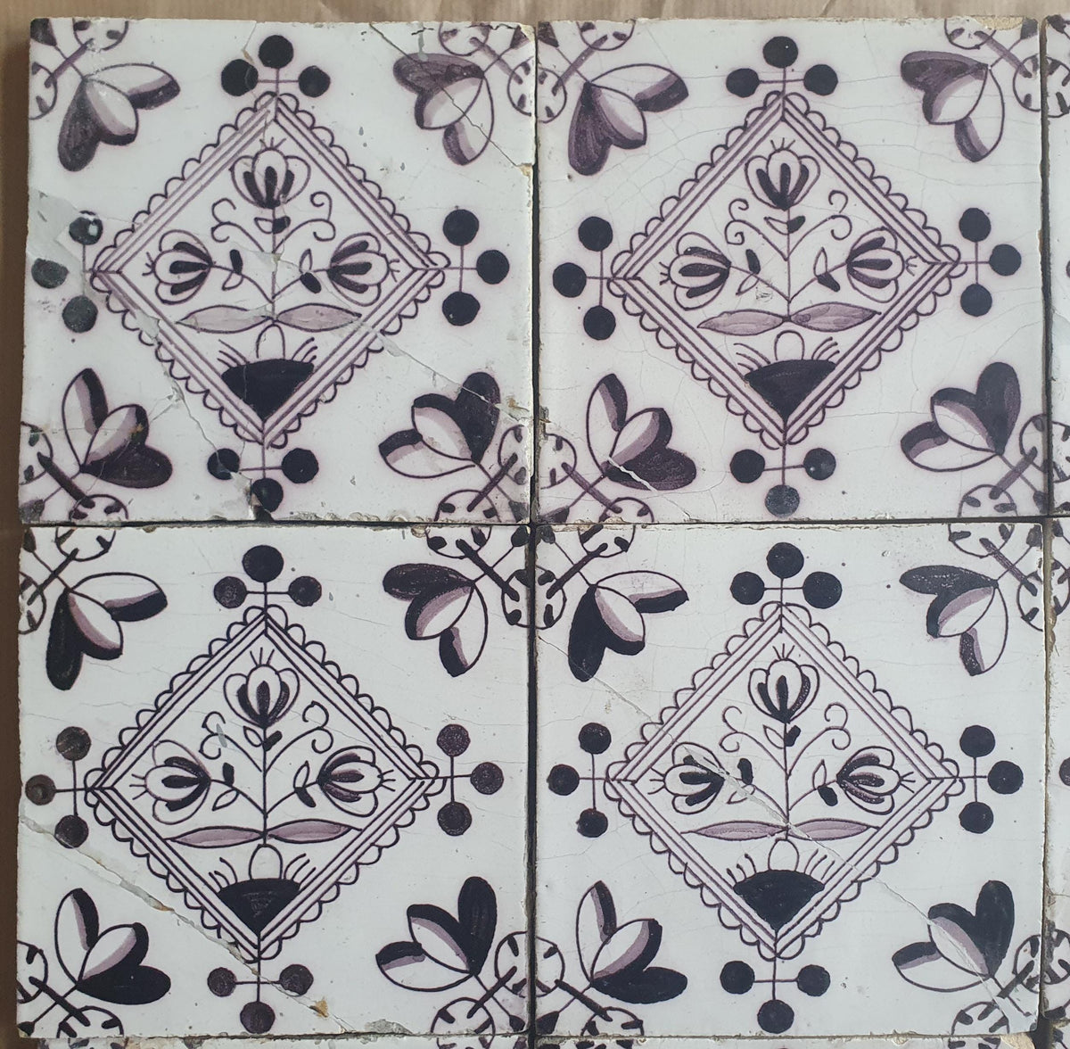 Set of 9 antique Dutch wall tiles, circular tiles featuring flower vases in manganese; Delft Blue Dutch backsplash fireplace tiles.