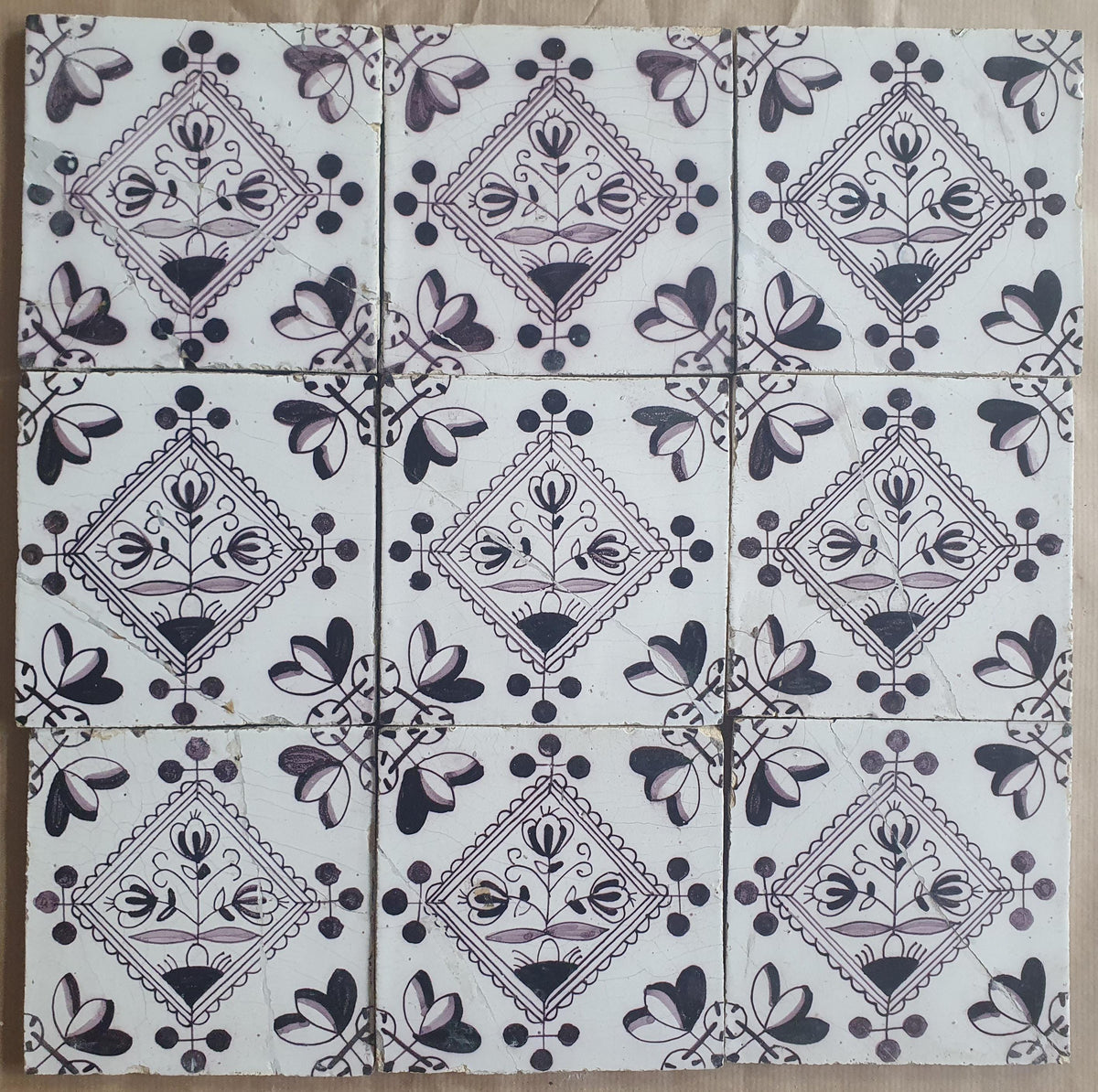 Set of 9 antique Dutch wall tiles, circular tiles featuring flower vases in manganese; Delft Blue Dutch backsplash fireplace tiles.