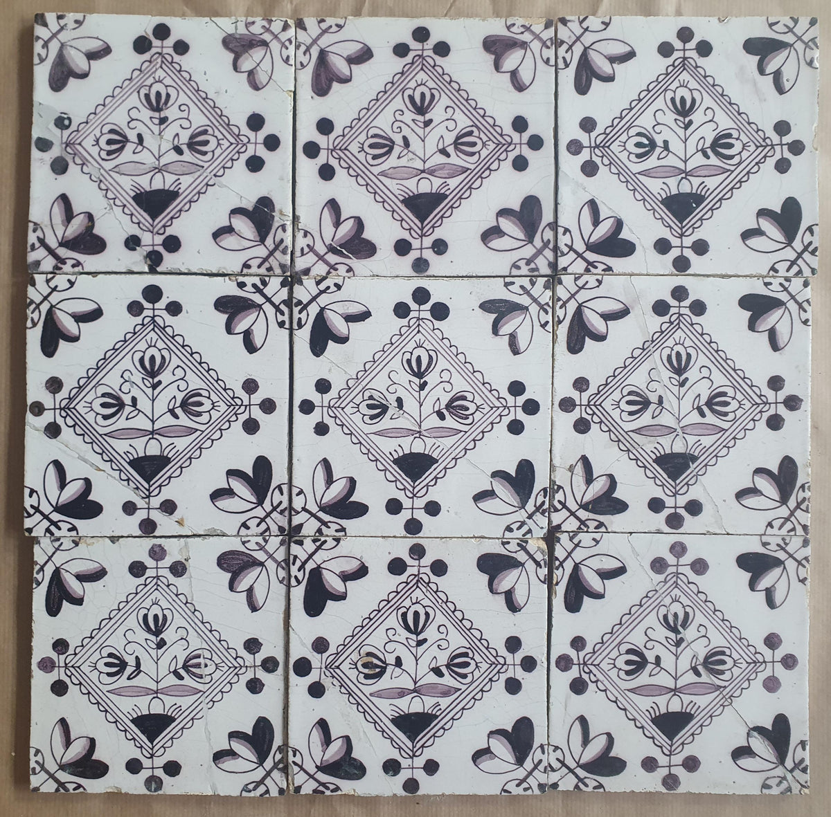 Set of 9 antique Dutch wall tiles, circular tiles featuring flower vases in manganese; Delft Blue Dutch backsplash fireplace tiles.
