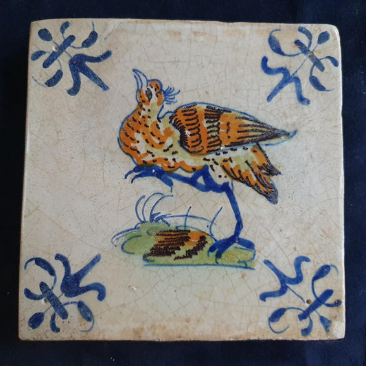 Antique Delft Tile - Polychrome  Bird with lily corner Motifs, Around 1640